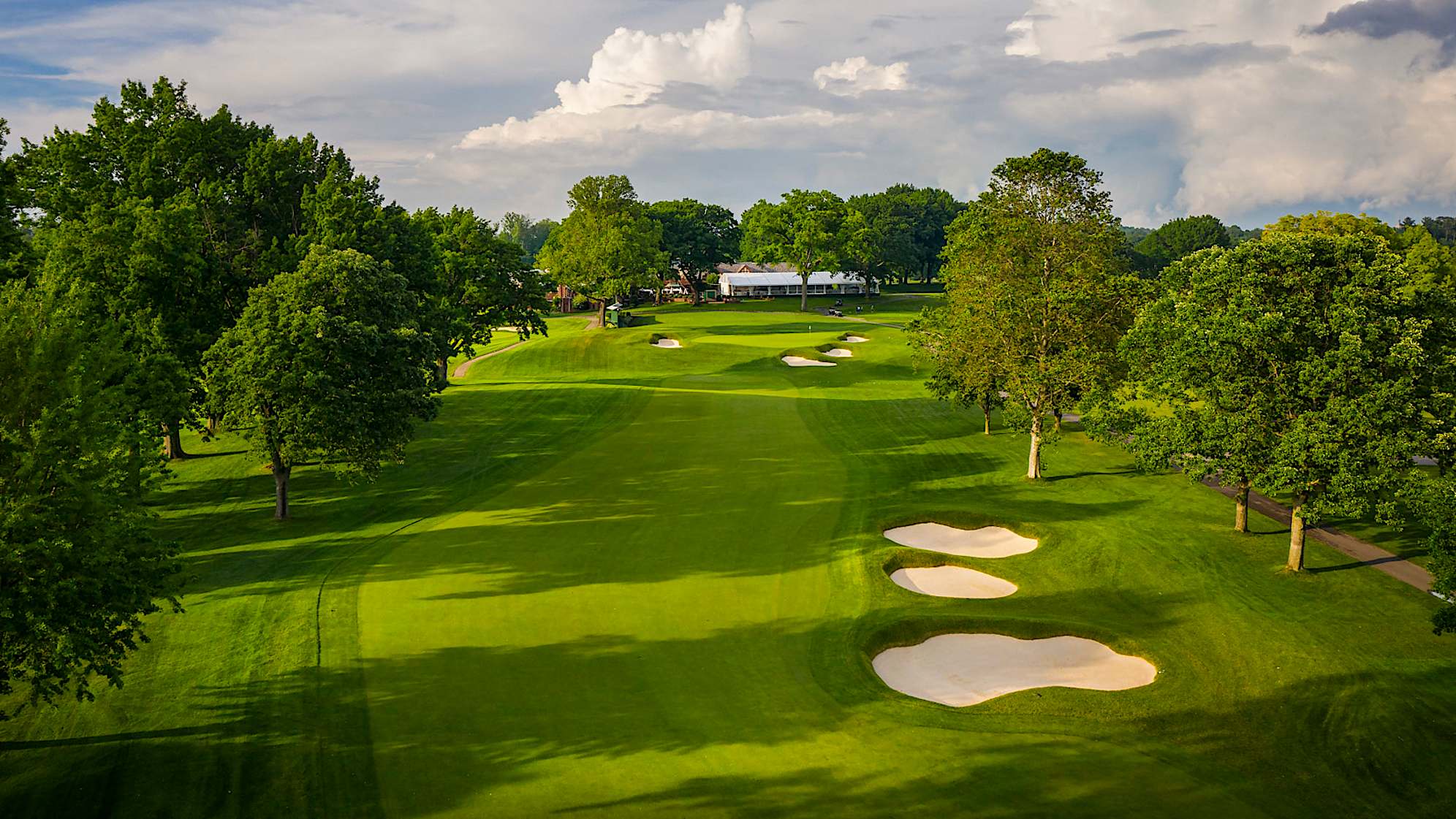 This hole is equally beautiful as it is demanding; the fairway is only 20 yards wide at the 300-yard mark. Three deep bunkers guard the right side off the tee, along with trees on both sides. The green slopes severely from back to front with three bunkers right and one on the left, likely proving to be a very challenging finish. (Source: PGA of America)