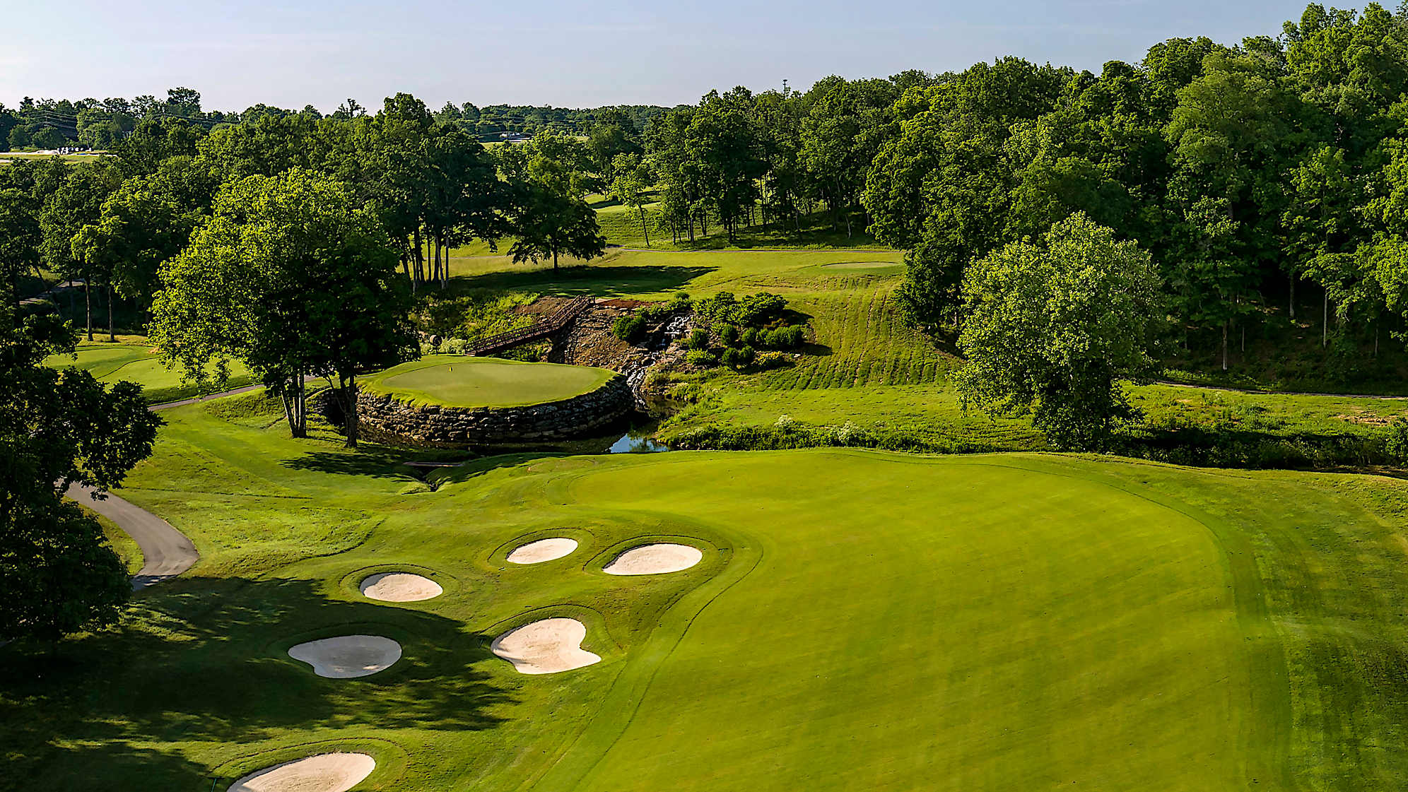 The Limestone Hole: Don’t let the distance deceive you: Yes, it’s the shortest two-shot hole on the course, but those two shots have to be good. A cluster of six bunkers sits just to the left of the fairway landing zone, while the green is a true island, surrounded by water and built up nearly 20 feet on large limestone boulders. (Source: PGA of America)