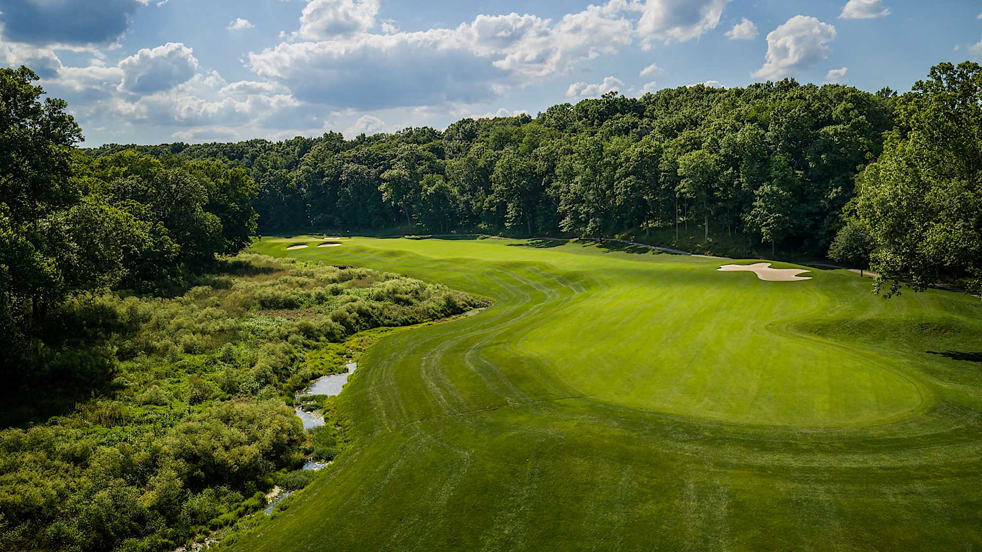 Winning Colors: Another slight dogleg left, this long par 4 is lined with beautiful Kentucky hardwoods. Tee shots need to stay clear of a finger of Floyd’s Fork, a waterway that runs along the left side of the fairway and green, and continues to meander through the front nine. Also protecting the angled green are three bunkers, two front-left and one back-right. (Source: PGA of America)