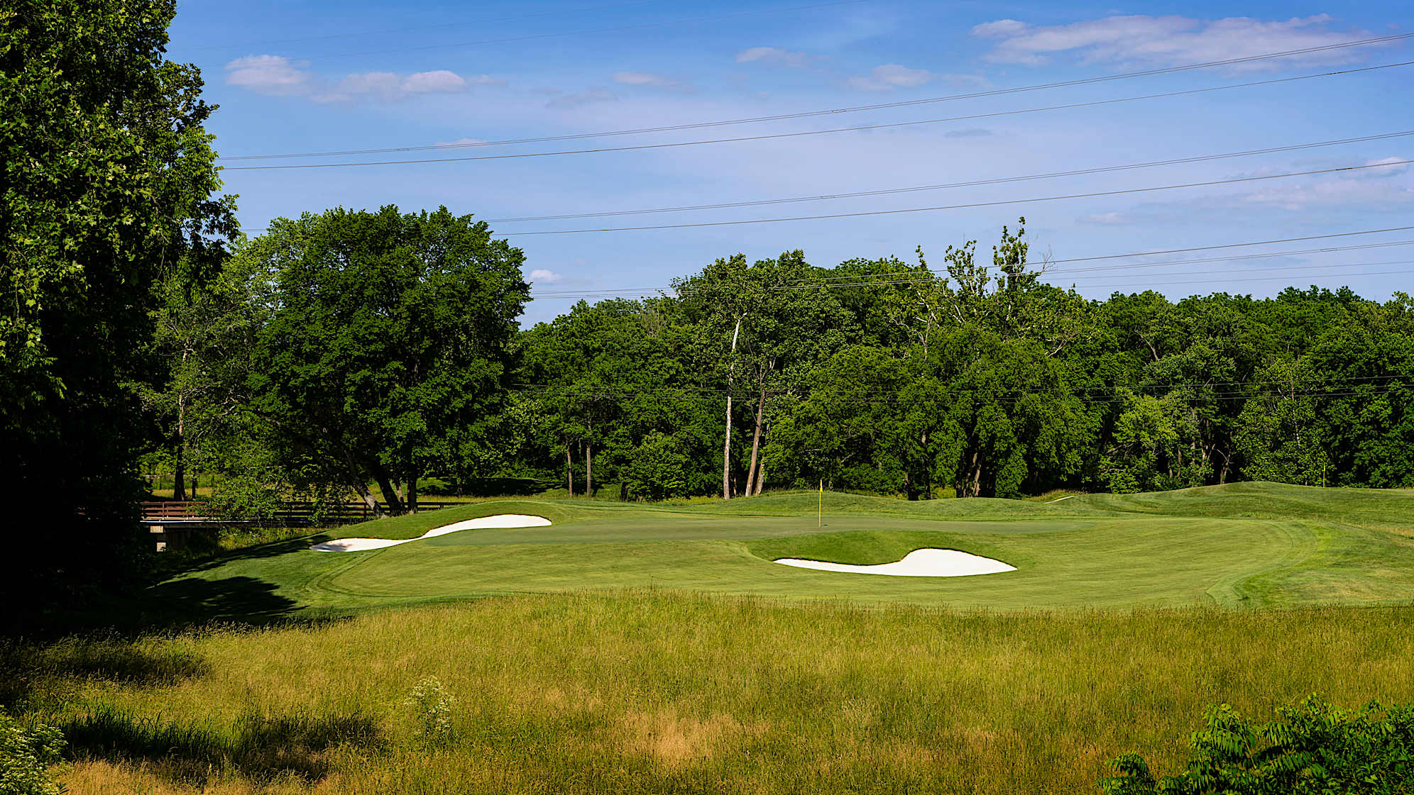 Float Like A Butterfly: It’s only a short- to middle-iron in, but the green complex is as dangerous as a Muhammad Ali combination. The front is protected by a deep bunker and a severe, closely manicured collection area. There is another bunker left, and another low-mow collection area beyond the green. The large, angled green affords numerous testing hole locations. (Source: PGA of America)
