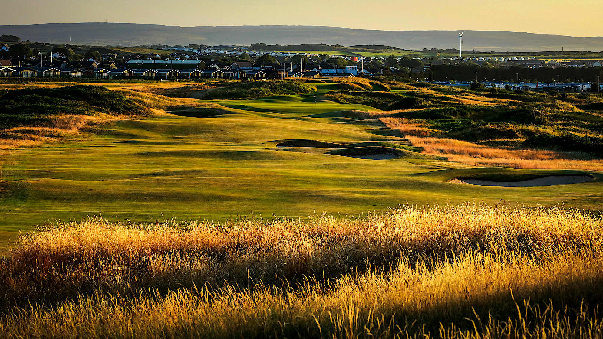 DHU VARREN: A new tee position has been created to allow the 12th hole to be played as a par 5 in championship golf. The fairway slopes from left to right making the bunkers down the right a must to be avoided. The green will be in range for the majority of the players but it’s a very tricky green that is again elevated with a false front. Any miss right with the approach could lead balls back into a stream of water lurking dangerously in the gully to the right of the green. (Descriptions courtesy of the R&A)