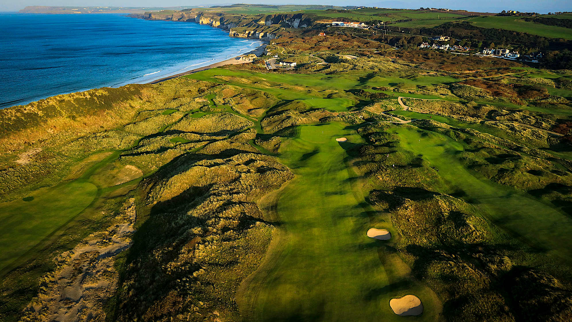 DUNLUCE: The eighth is the second of the new holes, cut from a piece of land where golf has never been played. A slight dogleg left with a tee-shot played out over a ravine tempting the best players in the world to bite off as much of the steep dune bank as possible. Players will also need to avoid the bunkers down the right of the fairway to leave the shortest and simplest shot into the green. Any approach shot missing short and left will find some difficult spots way below the elevated green. (Descriptions courtesy of the R&A)