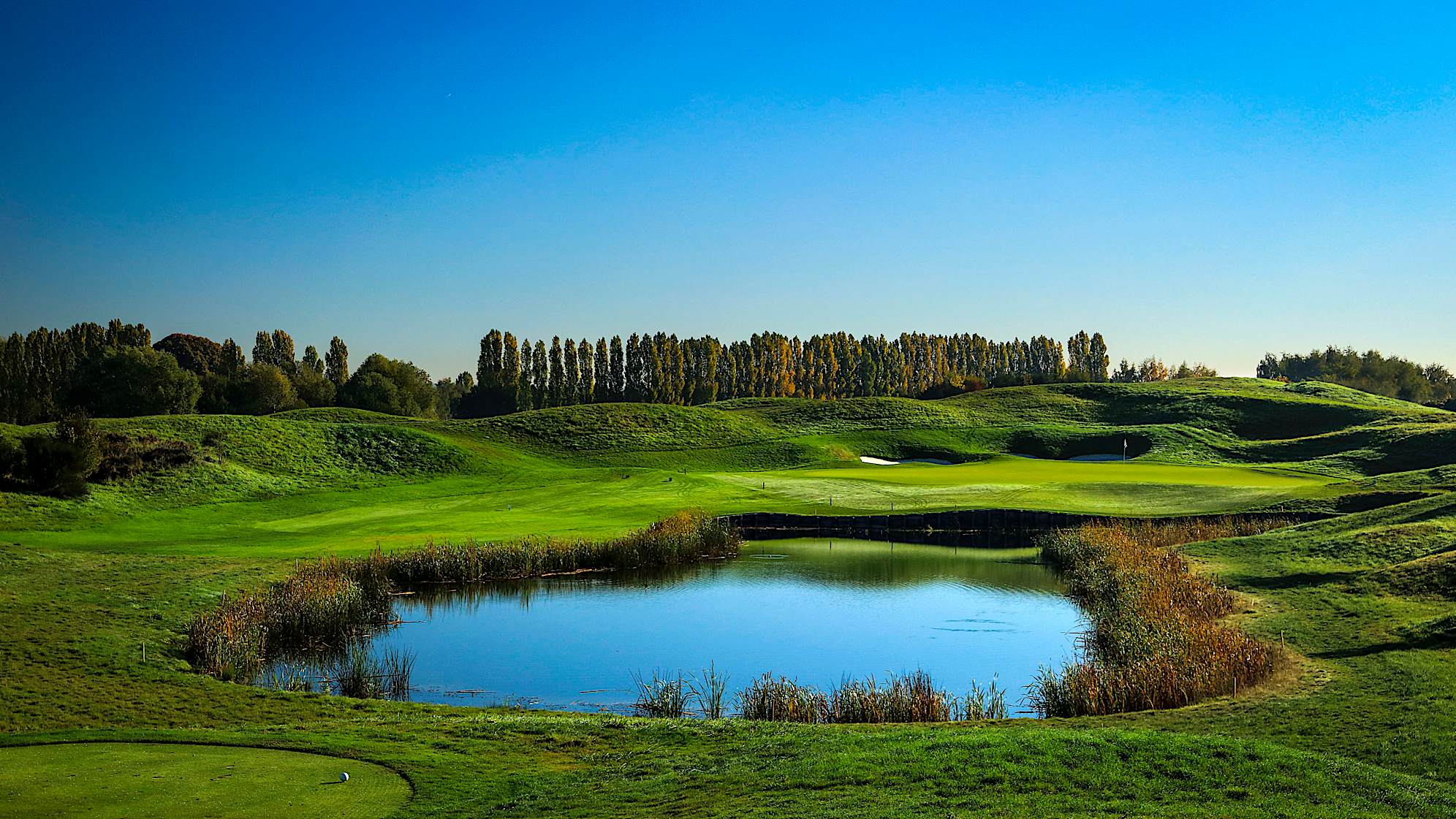 This hole was completely revamped in 2016, with the water hazard extended and the addition of two new bunkers at the back of the green. Depending on the location of the pin on its sloped green, this par 3 offers no guarantee of par. (Source: PGA of America)