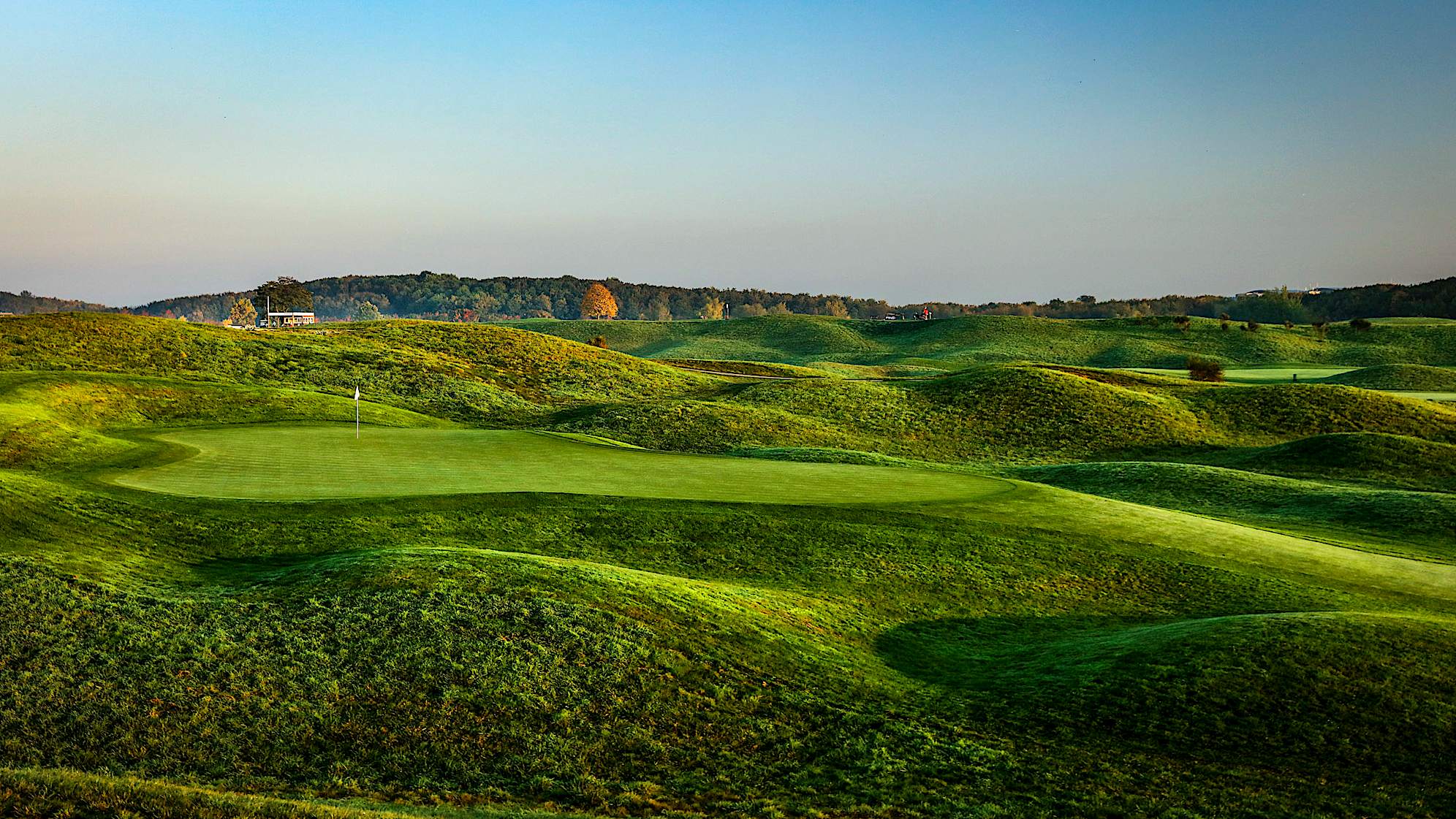 A dogleg-right with a huge bunker on the bottom right of the fairway, the tee shot on the 12th is no easy matter. In fact, the longer your drive is, the narrower the fairway gets. Only a drive carrying the bunker and ending up in the bottleneck a few yards ahead will offer you the ideal spot for your second shot to this elevated green. Players heading for the green from either the high rough or the bunker seldom reach the putting surface with their second shot and they might even struggle scrambling on this large, bumpy green. (Source: PGA of America)