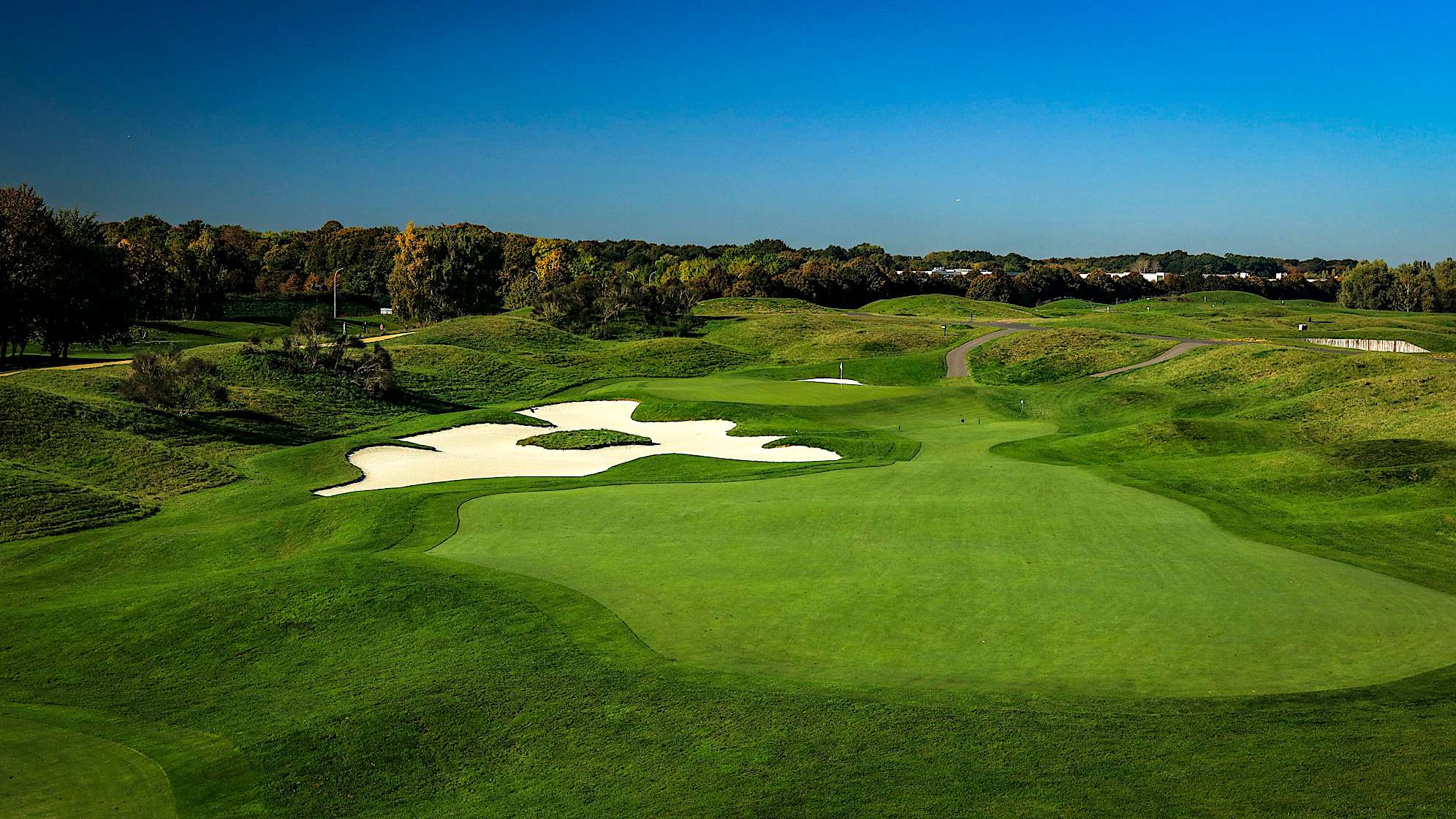 The last of the holes extended in 2004, the 14th has a large bunker defending the green, which is difficult to reach in two. Even big-hitting players will find it difficult to reach, particularly when swinging into the wind. The two-tier green also presents a challenge to players looking to gain an advantage here. (Source: PGA of America)