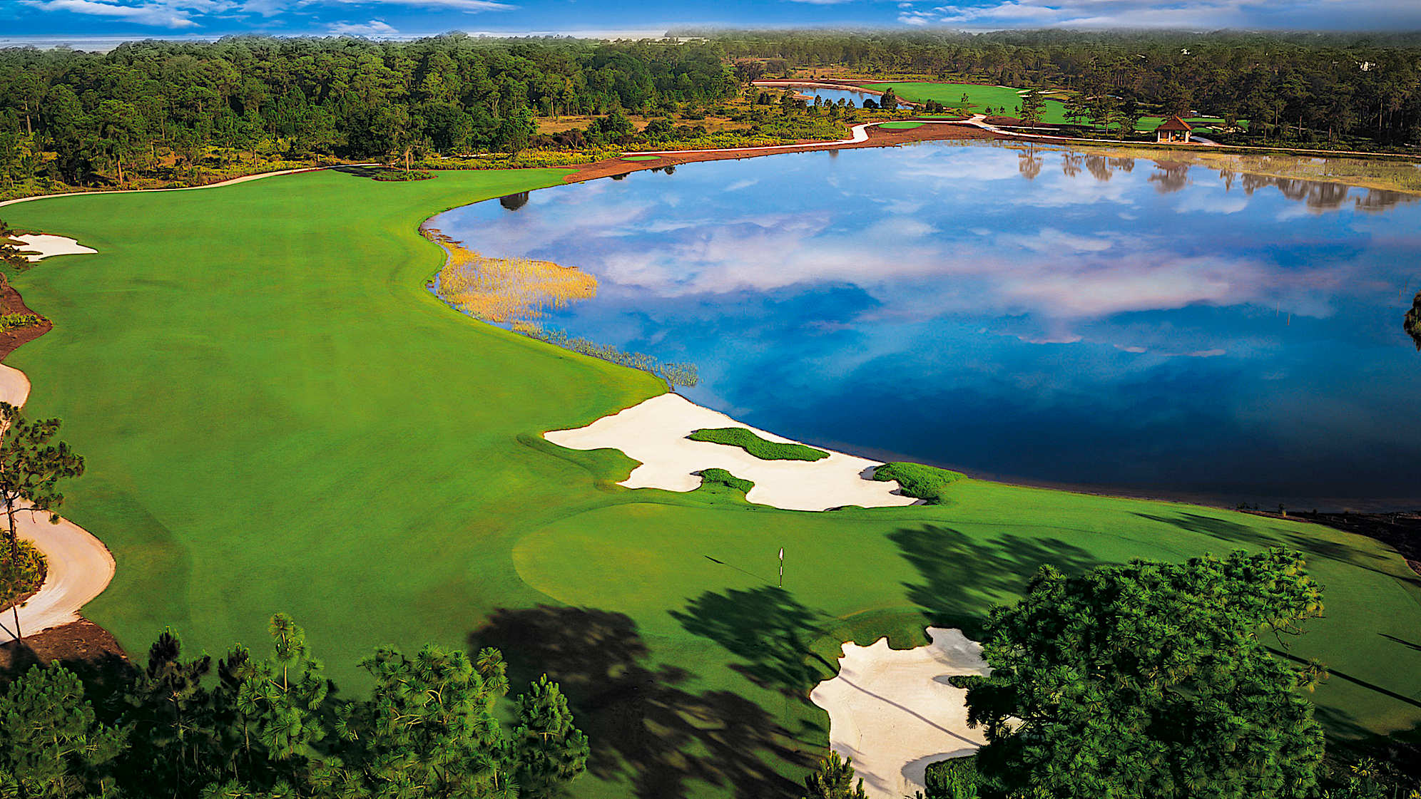 Your tee shot target is just left of the fairway bunker on this imposing par 4. If playing downwind, a fairway metal might be your best bet. A mid- to short-iron approach to a green guarded on the left by a bunker and water remains. Bail out short and right if you must.