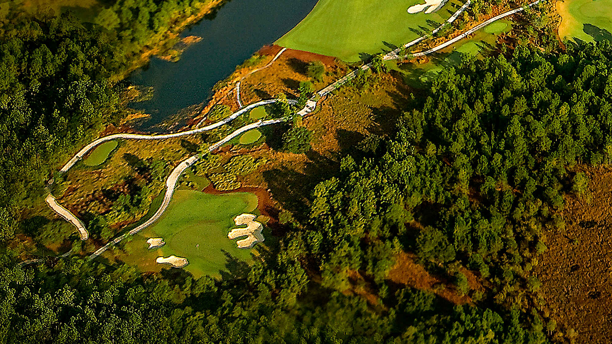 Hole location will determine how this long par 3 should be played. If the pin is back left, add one club and be aggressive. If the pin is middle to right front, being short is okay. Large bunkers frame the elevated green.