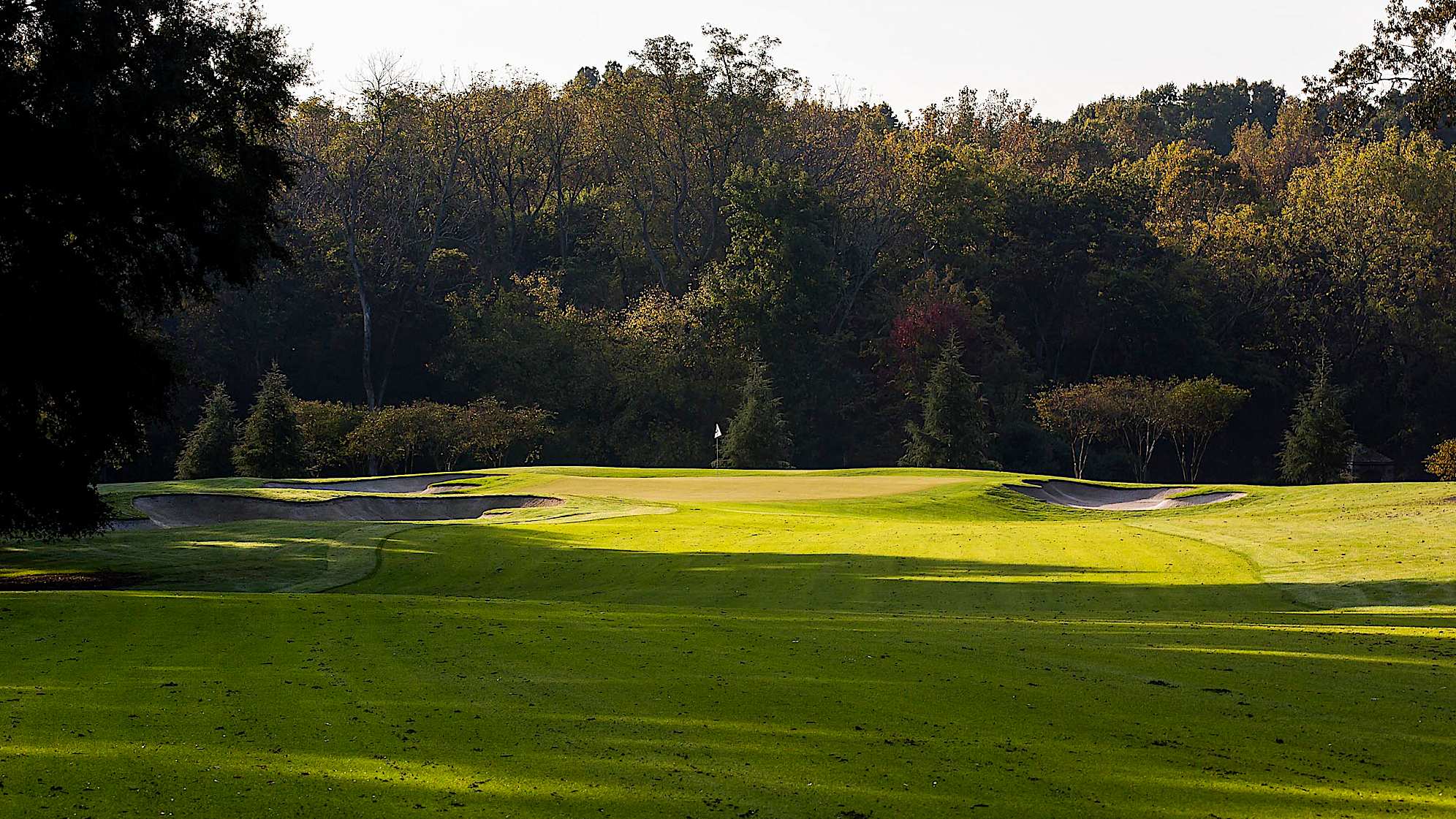 The 10th hole is the longest and most arduous of the par 5s. For an eagle opportunity, players must overcome bunkers on the left with a 300-yard drive and then tackle a formidable second shot. It is likely that most players will lay up short of the green for a short wedge shot that should keep the ball below the hole. The back-to-front and right-to-left sloping green will also call for a great deal of skill; if a player should miscalculate, putts are tough shots indeed.The green on Quail Hollow's signature 17th hole is nearly an island, forcing a 200-yard carry to clear the water. A fade is also required to settle the ball on a precariously perched, back-to-front and right-to-left sloping green. Enjoy the birdie-or-blunder potential this hole presents, as well as the view of the lake stretched out behind the green. (PGA TOUR)