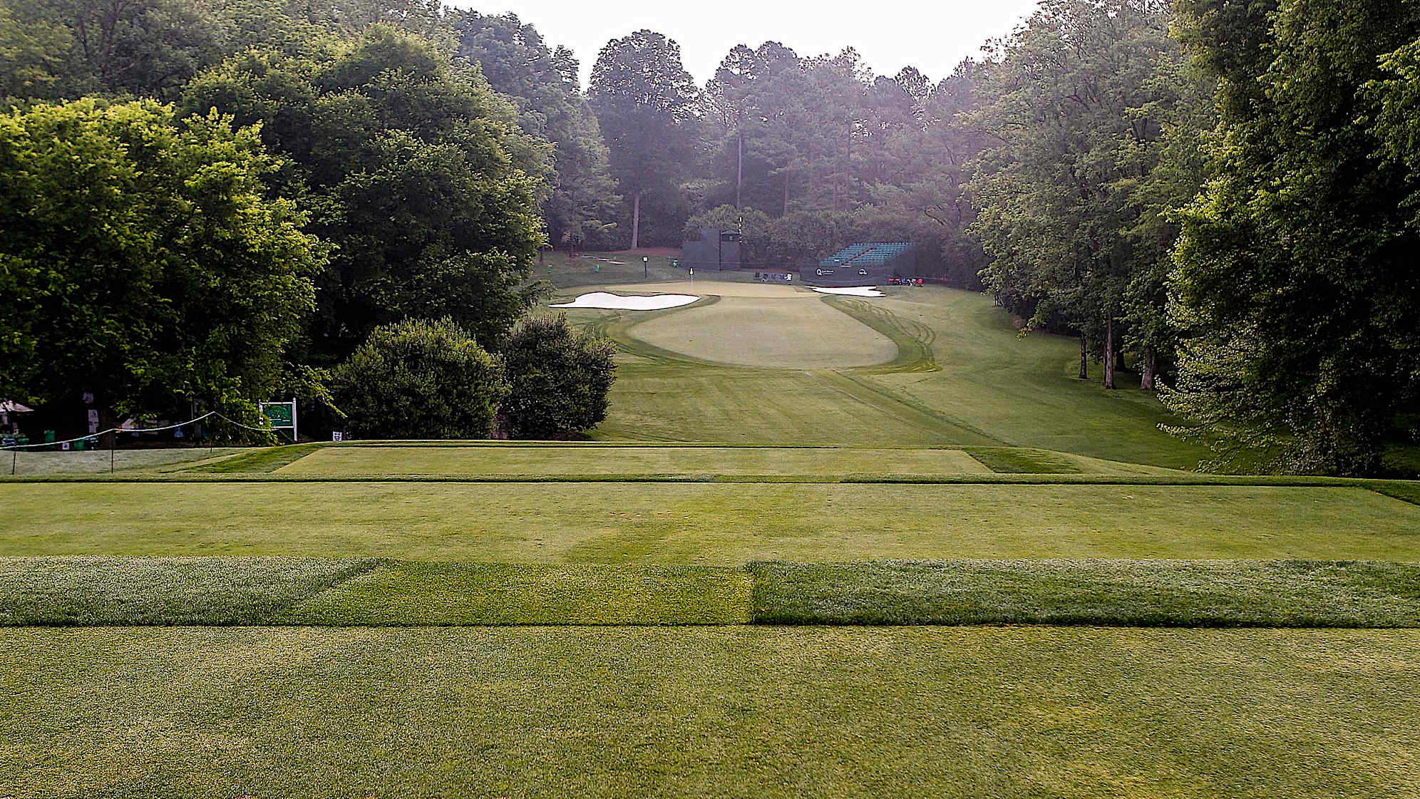 The par-3 13th begins a series of holes that will challenge the best players in the world. A 200-yard mid-iron shot is needed to reach an exacting green that lies between two large bunkers. The two-level green has a sizable collection area on the right middle portion as well as a wicked back-to-front slope. This one is an easy par, but a difficult birdie.The green on Quail Hollow's signature 17th hole is nearly an island, forcing a 200-yard carry to clear the water. A fade is also required to settle the ball on a precariously perched, back-to-front and right-to-left sloping green. Enjoy the birdie-or-blunder potential this hole presents, as well as the view of the lake stretched out behind the green. (PGA TOUR)