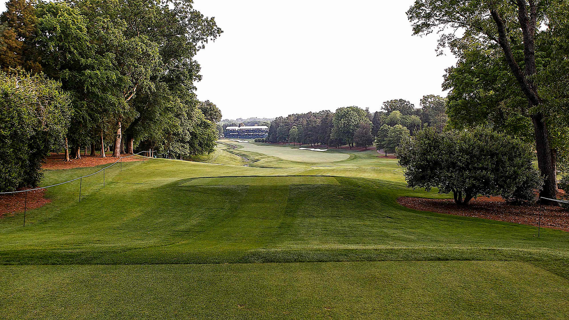 The 18th is the last of a three hole stretch dubbed "The Green Mile" and is consistently one of the toughest finishing holes in golf. On the tee shot, players must avoid a bunker on the right, as well as a creek that meanders along the entire left side of the narrow fairway. An uphill second shot must avoid hazards on both sides of the green, which is deep and sloped. If a player must birdie this hole to win the tournament, he will definitely have his hands full.The green on Quail Hollow's signature 17th hole is nearly an island, forcing a 200-yard carry to clear the water. A fade is also required to settle the ball on a precariously perched, back-to-front and right-to-left sloping green. Enjoy the birdie-or-blunder potential this hole presents, as well as the view of the lake stretched out behind the green. (PGA TOUR)