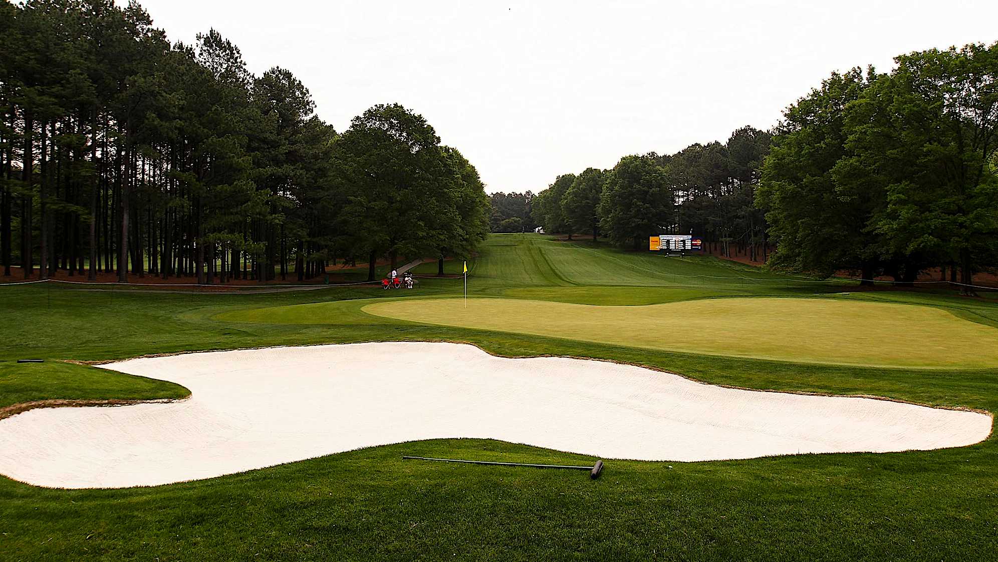 The 250-yard sixth hole is the longest par 3 on the course and plays slightly downhill. A metal-wood or long iron is advisable for the tee shot. The green, which slopes from back to front on three different levels, follows Quail Hollow's propensity for devilish contours and gives players an opportunity to showcase their ability to conquer demanding short shots and putts.The green on Quail Hollow's signature 17th hole is nearly an island, forcing a 200-yard carry to clear the water. A fade is also required to settle the ball on a precariously perched, back-to-front and right-to-left sloping green. Enjoy the birdie-or-blunder potential this hole presents, as well as the view of the lake stretched out behind the green. (PGA TOUR)