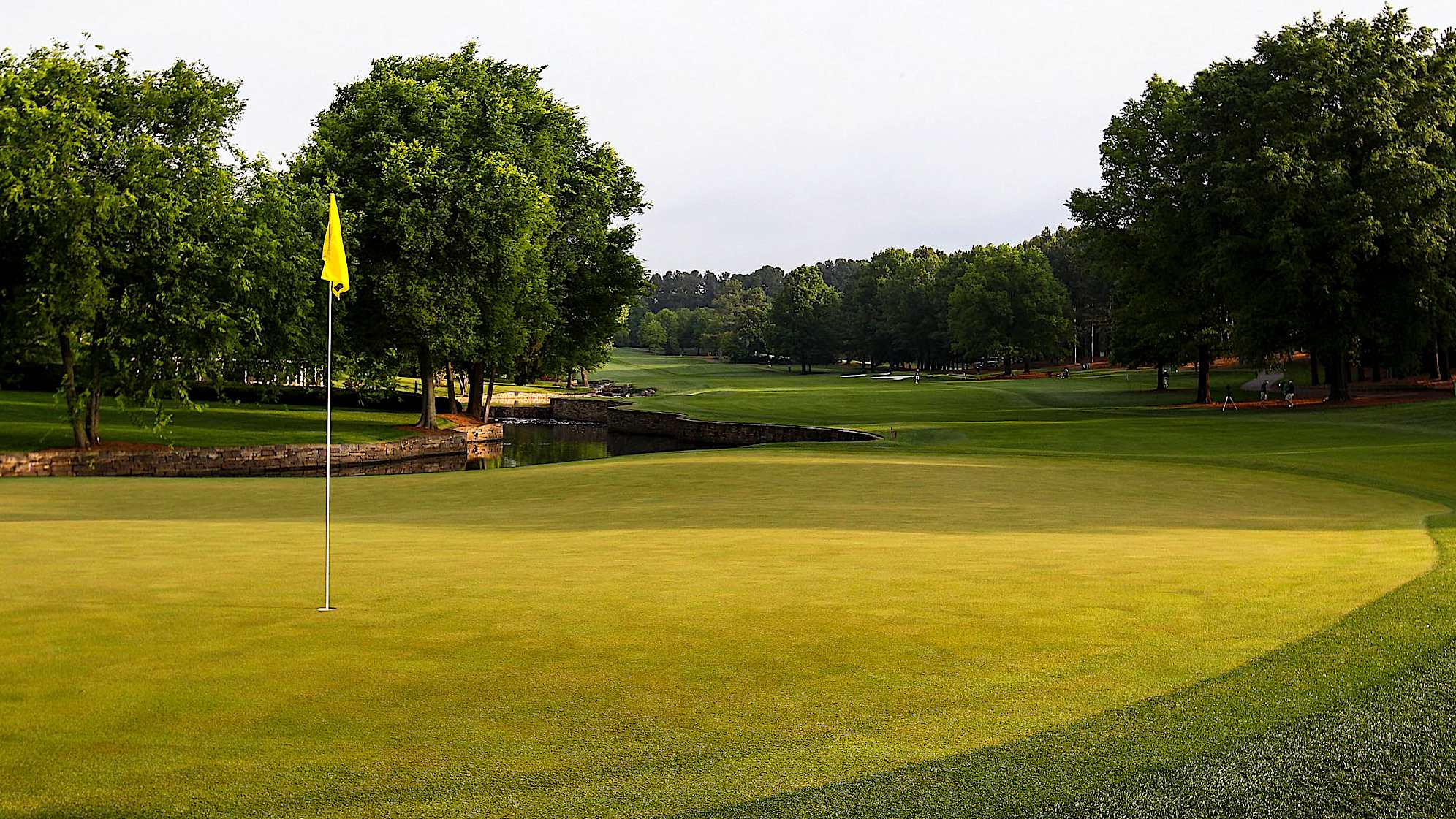The seventh hole is the shortest par 5 on the course and most of the players will reach the green in two, making eagle opportunities a real possibility. It is a tight driving hole and tee shots must navigate bunkers on the left, plus a creek that runs down the entire right side. The sloped green is tucked behind water and surrounded by bunkers, making this hole a harder endeavor than it first appears.The green on Quail Hollow's signature 17th hole is nearly an island, forcing a 200-yard carry to clear the water. A fade is also required to settle the ball on a precariously perched, back-to-front and right-to-left sloping green. Enjoy the birdie-or-blunder potential this hole presents, as well as the view of the lake stretched out behind the green. (PGA TOUR)