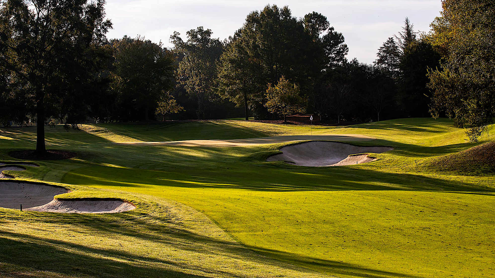 Despite its length, the short, risk/reward par-4 eighth hole can be very challenging. Players may try to drive the green or opt to lay up and play a wedge from the sloped fairway. Shots to the very deep, narrow green can vary by up to three clubs depending on the hole placement.The green on Quail Hollow's signature 17th hole is nearly an island, forcing a 200-yard carry to clear the water. A fade is also required to settle the ball on a precariously perched, back-to-front and right-to-left sloping green. Enjoy the birdie-or-blunder potential this hole presents, as well as the view of the lake stretched out behind the green. (PGA TOUR)