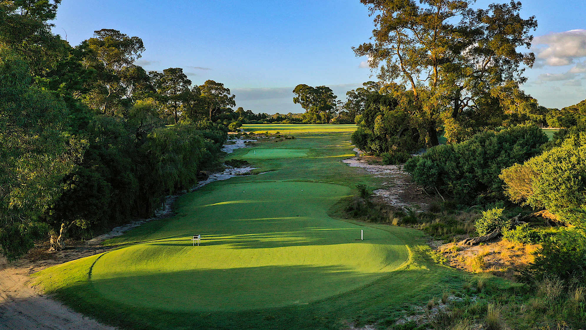 Hole 16: Par 4, 397 meters (2028 Presidents Cup Hole No. 8)  The first of a trio of great finishing par 4s. This hole doglegs right with a large number of bunkers perfectly placed to deter or challenge long hitters. The extremely fast, sloping green requires a delicate putting touch.