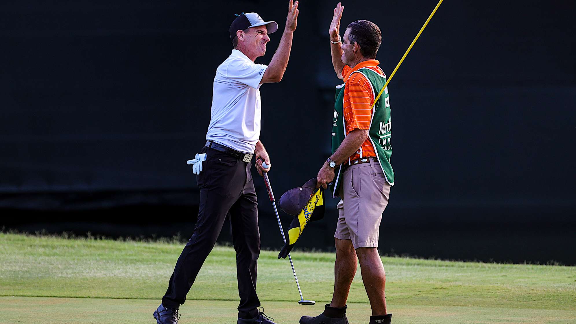THE WOODLANDS, TEXAS - MAY 01: Steven Alker of New Zealand celebrates on the 18th hole with his caddie Sam Workman after winning the Insperity Invitational at The Woodlands Golf Club on May 01, 2022 in The Woodlands, Texas. (Photo by Logan Riely/Getty Images)