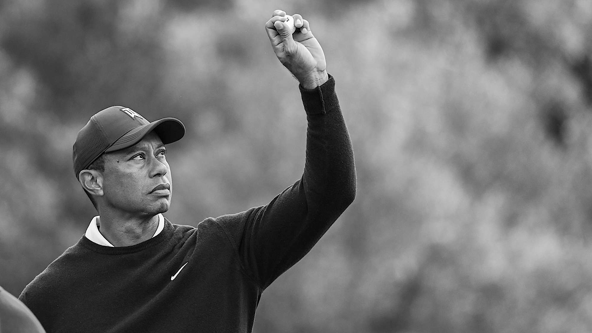 PACIFIC PALISADES, CA - FEBRUARY 16:  Tiger Woods catches a golf ball on the 13th hole green during the first round of the Genesis Invitational at Riviera Country Club on February 16, 2023 in Pacific Palisades, California. (Photo by Keyur Khamar/PGA TOUR via Getty Images)