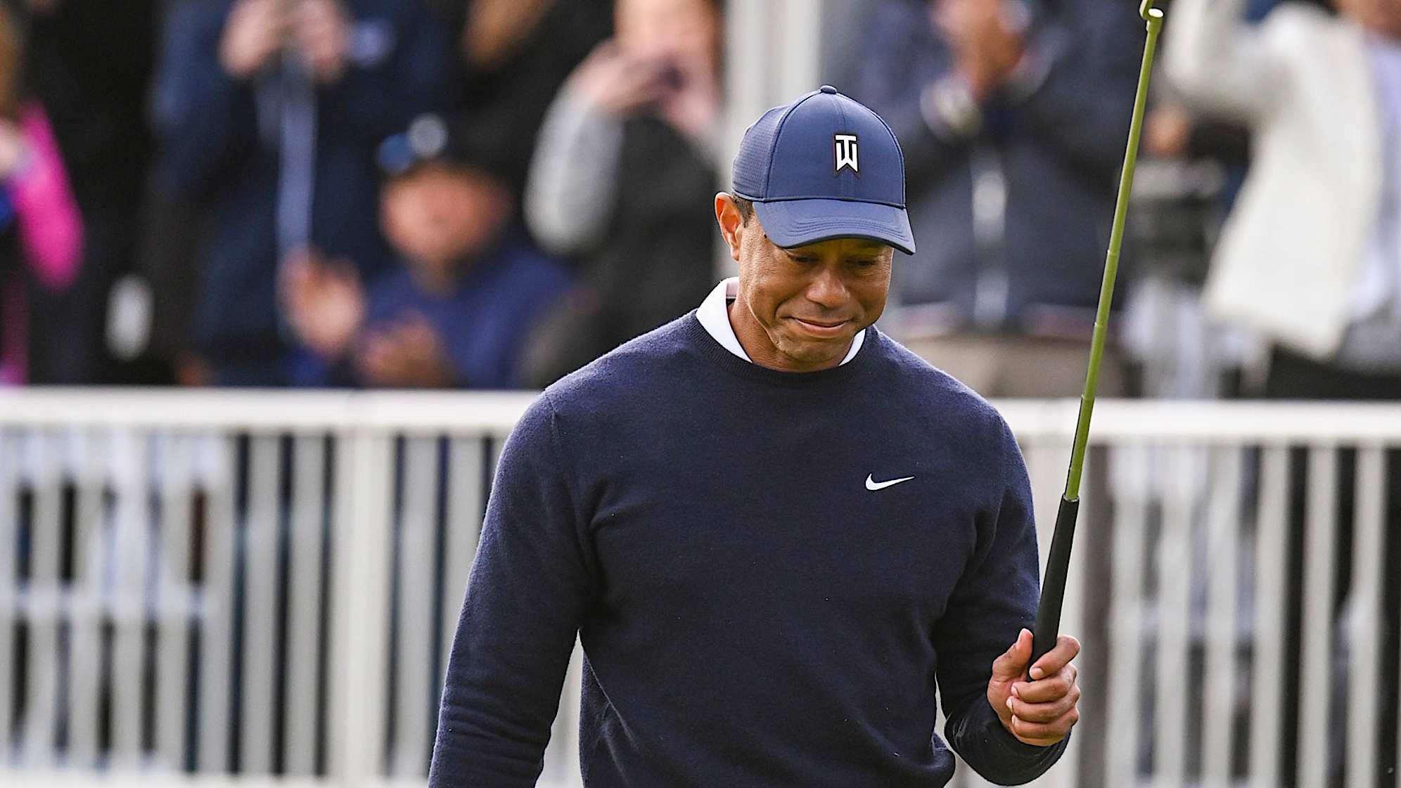 PACIFIC PALISADES, CA - FEBRUARY 16:  Tiger Woods smiles and raises his putter after making a birdie putt on the 17th hole green during the first round of the Genesis Invitational at Riviera Country Club on February 16, 2023 in Pacific Palisades, California. (Photo by Keyur Khamar/PGA TOUR via Getty Images)