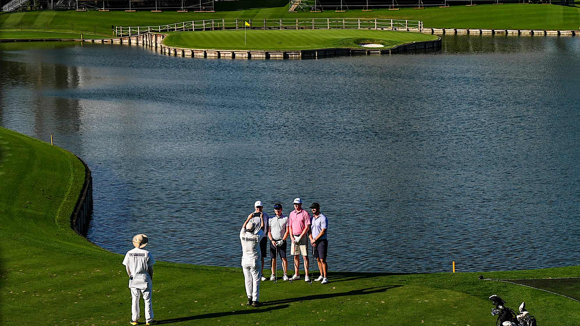 A caddie takes a photo of a foursome on the 17th tee on the Stadium Course at TPC Sawgrass, home of THE PLAYERS Championship, on January 20, 2023 in Ponte Vedra Beach, Florida. (Photo by Keyur Khamar/PGA TOUR via Getty Images)