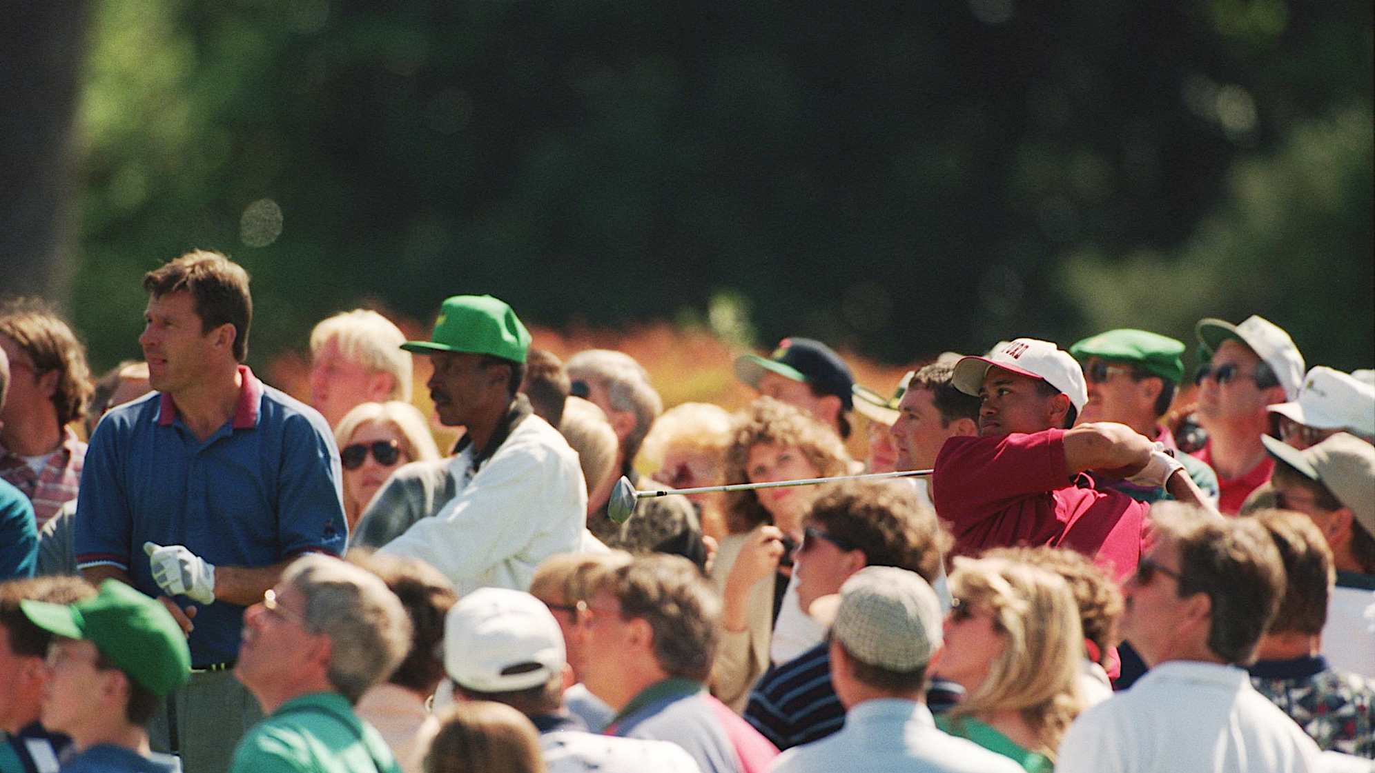 3 APR 1995:  US AMATEUR TIGER WOODS DRIVES OFF THE EIGHTH TEE AS NICK FALDO OF ENGLAND LOOKS ON DURING THE FIRST PRACTICE ROUND AT THE 1995 US MASTERS GOLF CHAMPIONSHIP AT AUGUSTA NATIONAL GOLF COURSE IN AUGUSTA, GEORGIA. Mandatory Credit: David Cannon/ALLSPORT