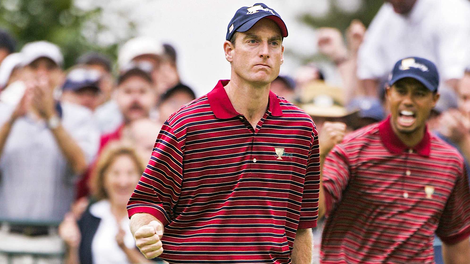 Jim Furyk and Tiger Woods of the U.S. team celebrate during the foursome matches in the third round of The Presidents Cup at Robert Trent Jones Golf Club in Prince William County, Virginia on September 24, 2005. (Photo by Stan Badz/PGA)