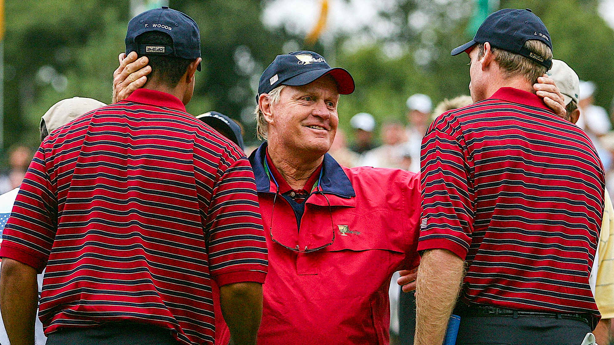 GAINESVILLE, VA - SEPTEMBER 24: USA team captian Jack Nicklaus greets his players Tiger Woods and Jim Furyk after they won 2up during the Saturday Four-Ball Matches at the 2005 Presidents Cup on September 24, 2005 at Robert Trent Jones Golf Club in Gainesville, Virginia. (Photo by Scott Halleran/Getty Images)
