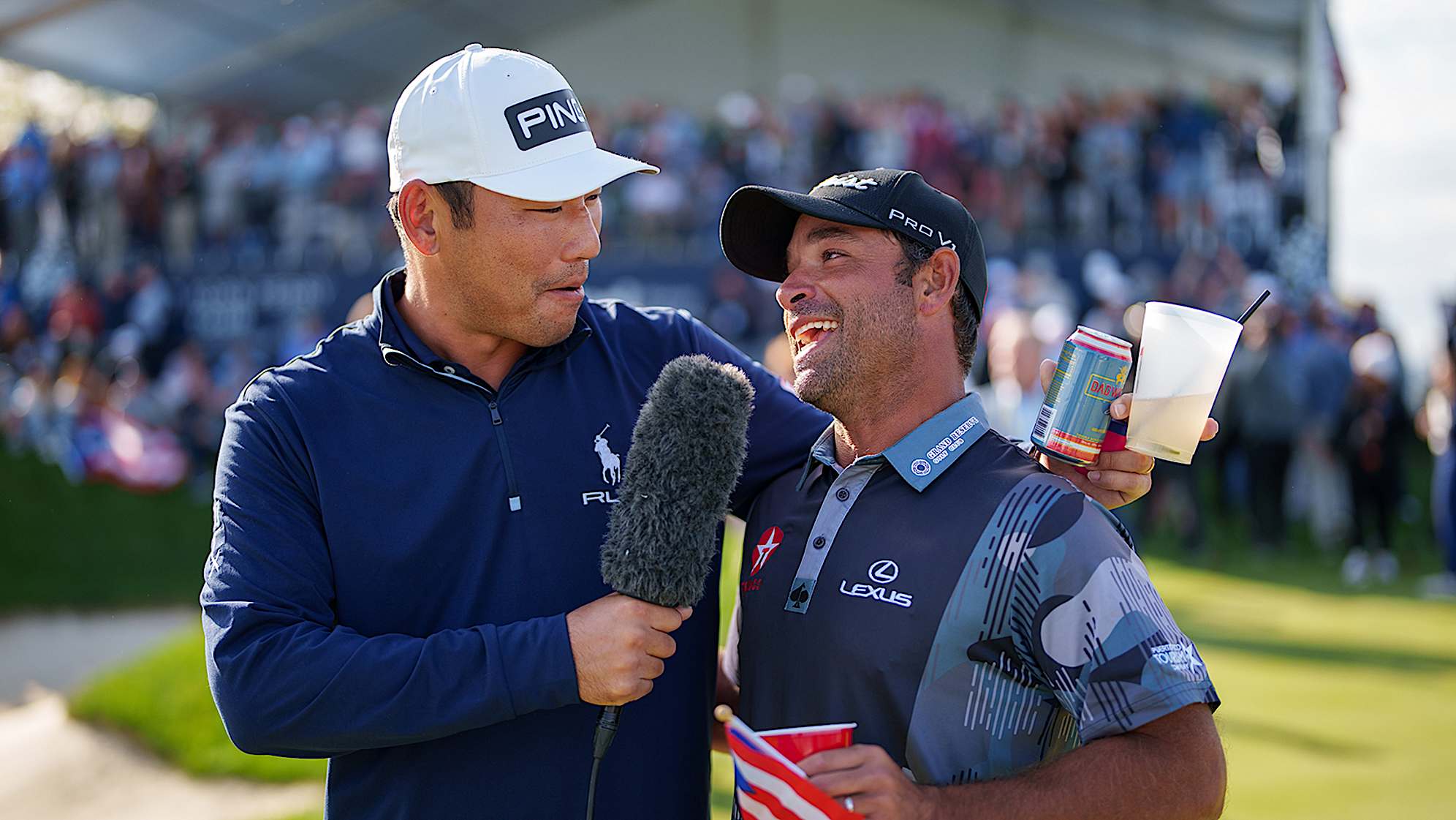 NEWBURGH, INDIANA - OCTOBER 08: Chan Kim of the United States interviews Rafael Campos of Puerto Rico during the trophy ceremony after the final round of the Korn Ferry Tour Championship presented by United Leasing and Finance at Victoria National Golf Club on October 8, 2023 in Newburgh, Indiana. (Photo by Andrew Wevers/PGA TOUR)