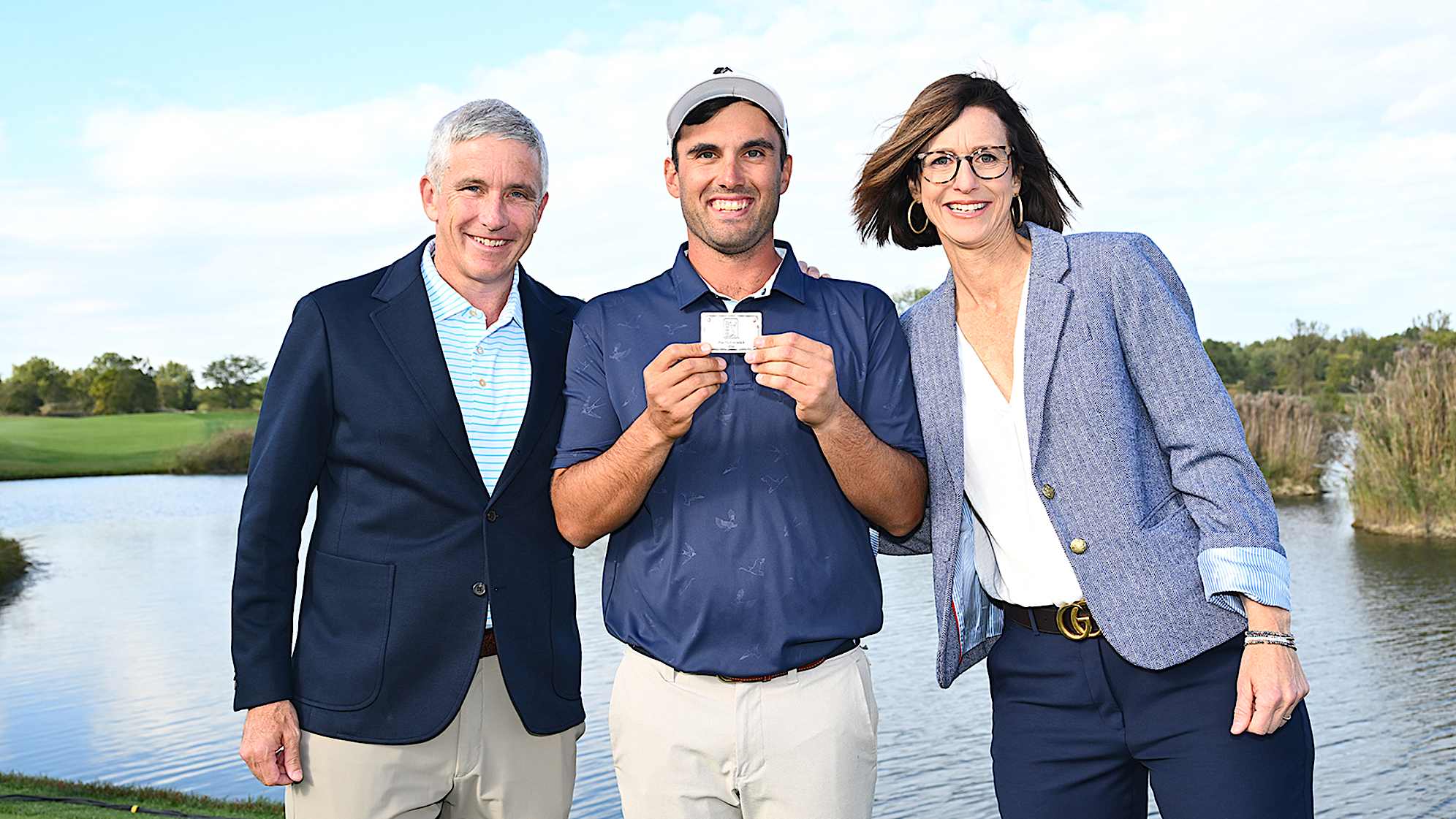 NEWBURGH, INDIANA - OCTOBER 08: Ryan McCormick holds up his TOUR Card while posing for a photo with Commissioner Jay Monahan and President of the Korn Ferry Tour Alex Baldwin during the card ceremony after the final round of the Korn Ferry Tour Championship presented by United Leasing and Financing at Victoria National Golf Club on October 8, 2023 in Newburgh, Indiana. (Photo by Jennifer Perez/PGA TOUR)