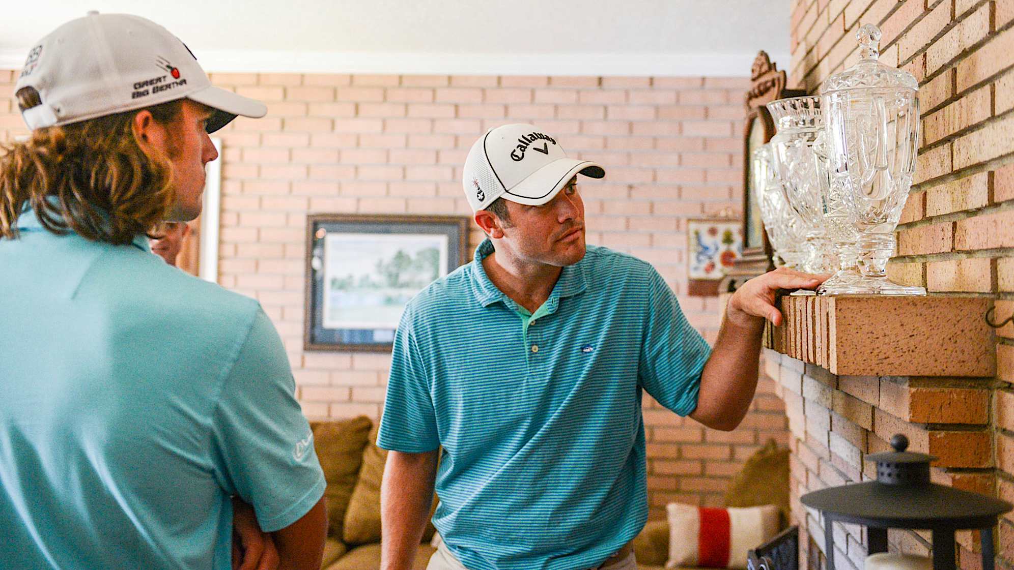 CHAPIN, SC - MAY 24:  George Bryan IV and Wesley Bryan look at trophies on display in their childhood home adjacent to the George Bryan Golf Academy on May 24, 2016 in Chapin, South Carolina. (Photo by Keyur Khamar/PGA TOUR)