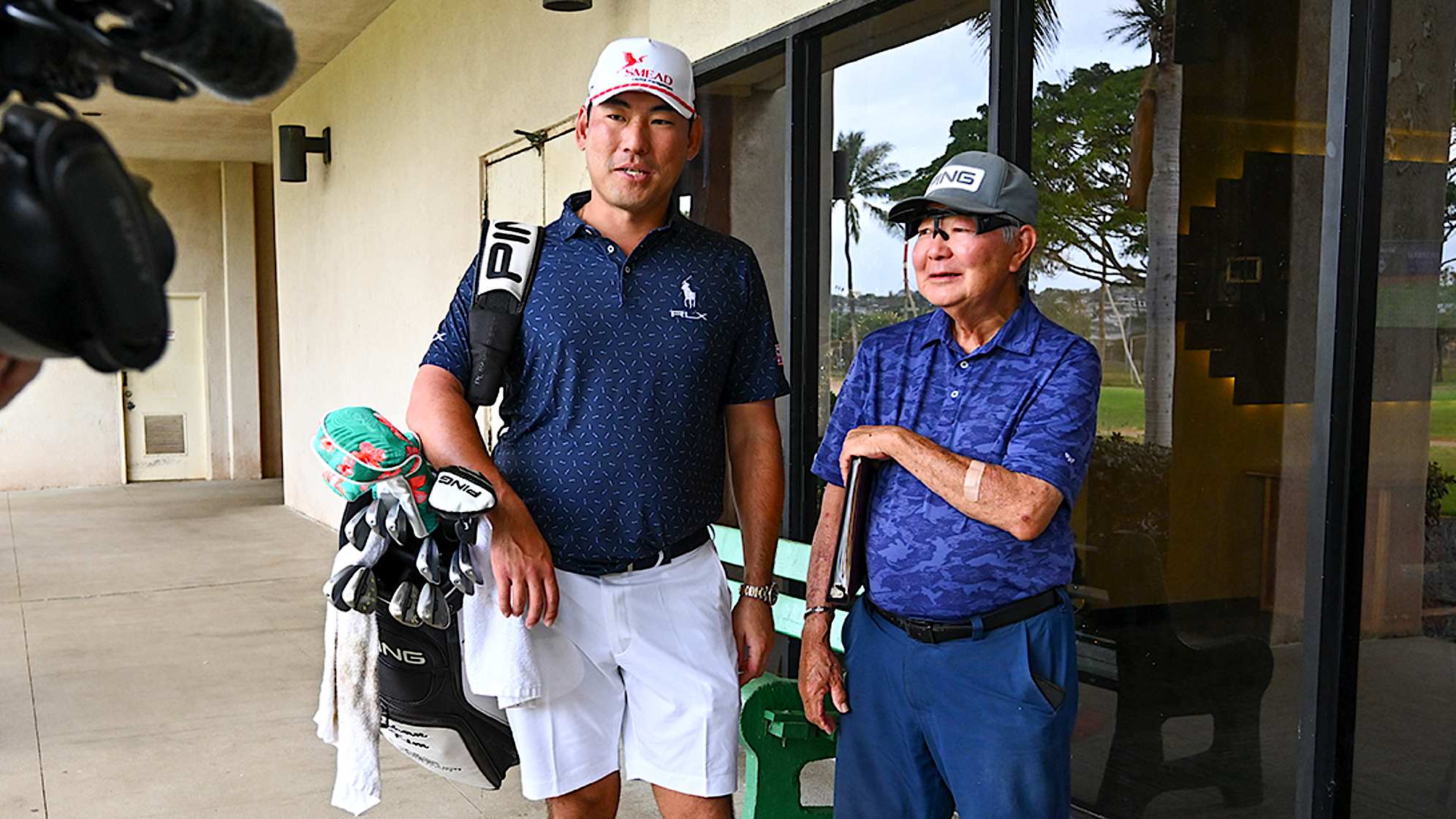 Chan Kim with his coach Les Uyehara at his course as a young player, Ala Wai Golf Course, prior to Sony Open in Hawaii. (Tracy Wilcox/PGA TOUR)