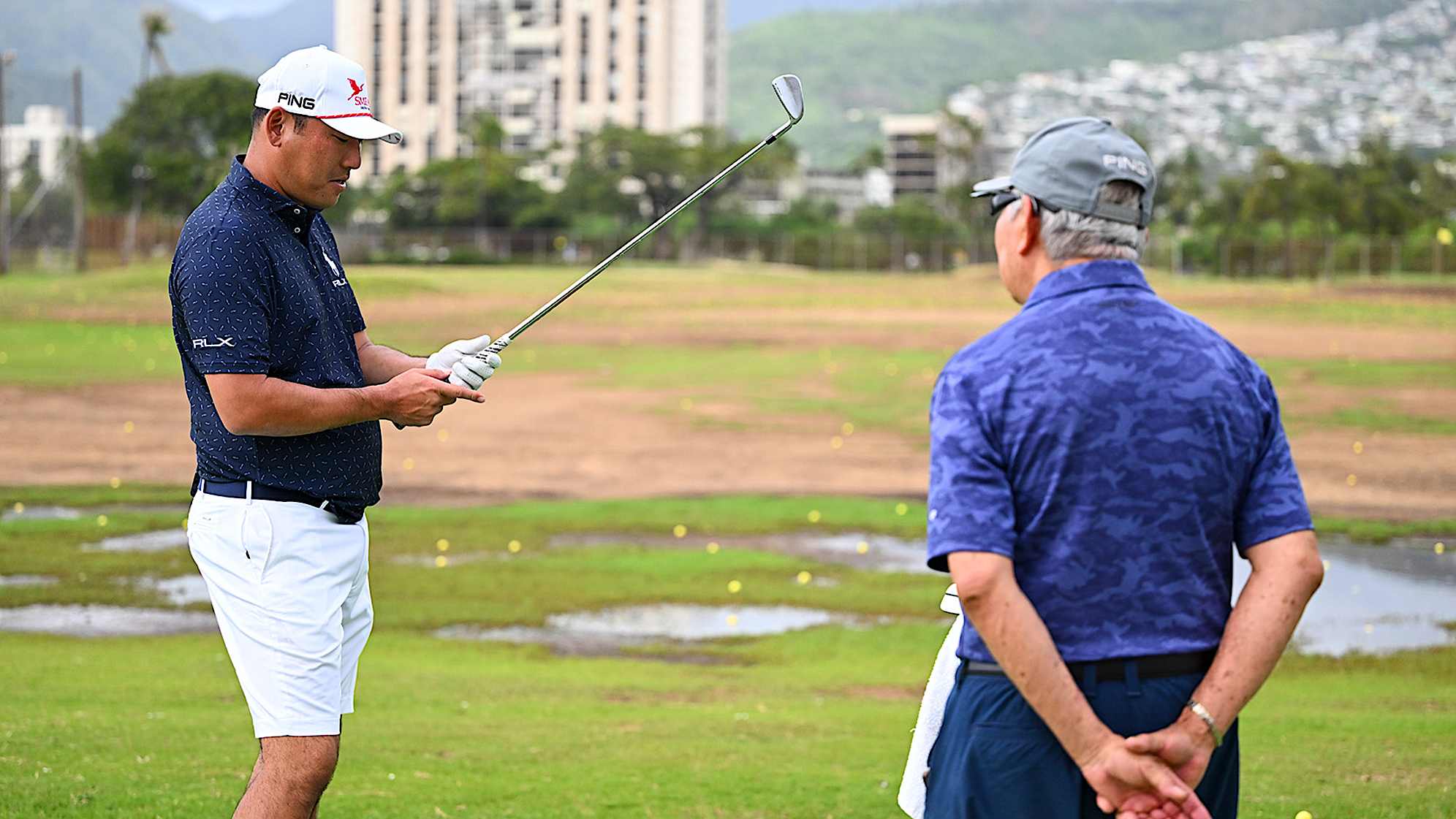 Chan Kim with his coach Les Uyehara at his course as a young player, Ala Wai Golf Course, prior to Sony Open. (Tracy Wilcox/PGA TOUR)
