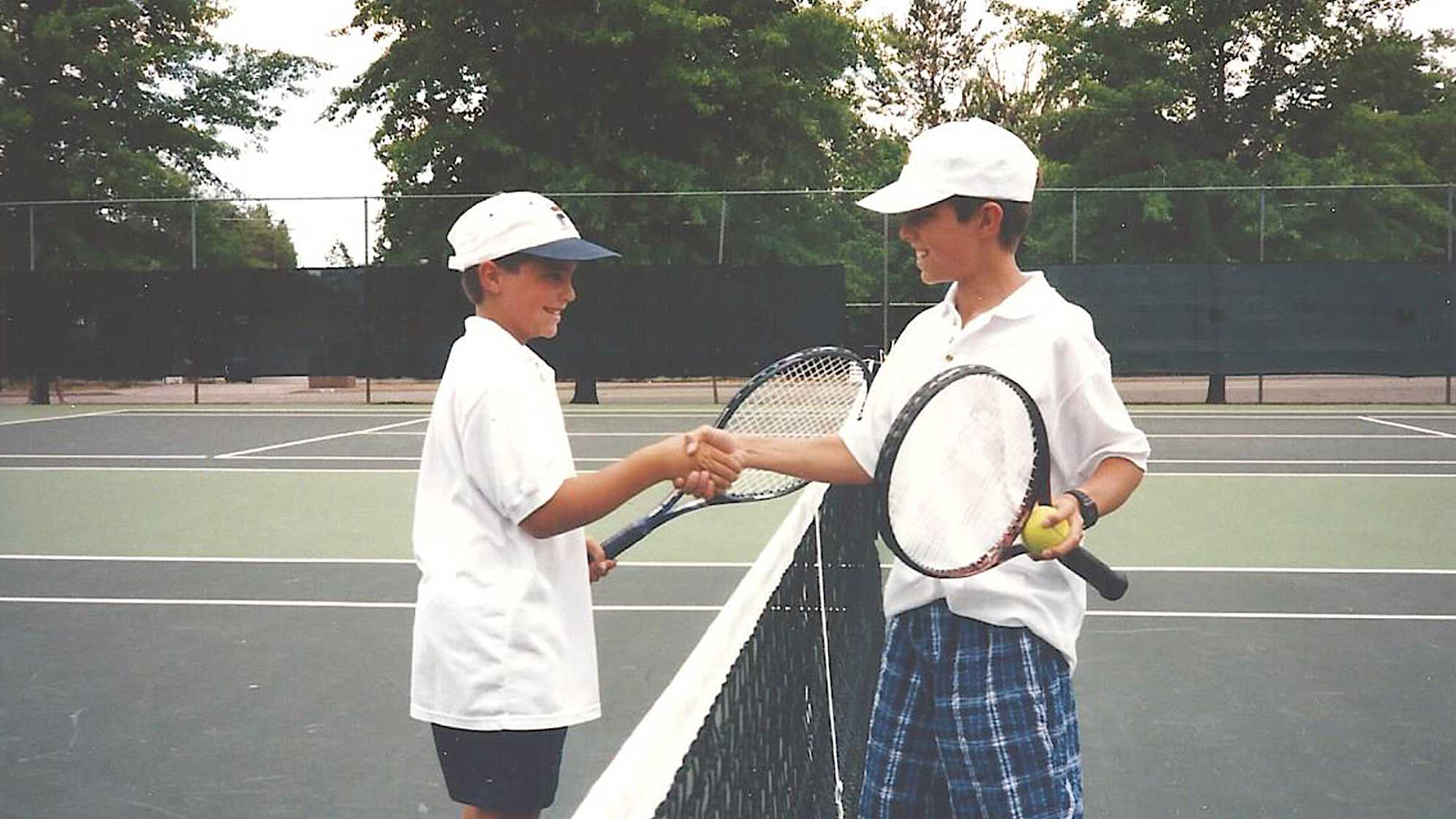 Tom Whitney (L) and Bob Whitney (R) playing tennis. (Photo courtesy of Whitney family)