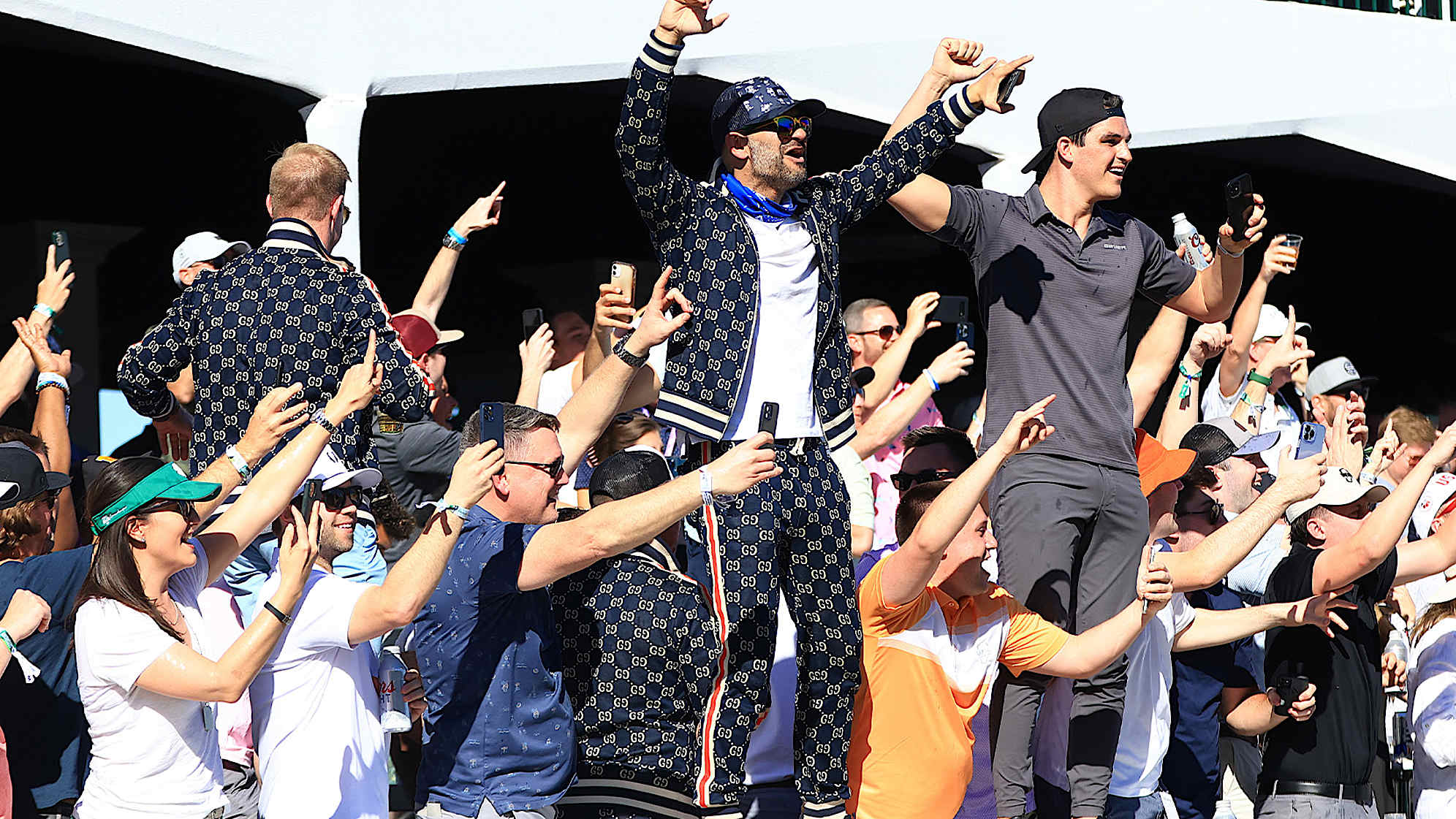 Fans cheer in the stands on the 16th hole after Sam Ryder's hole-in-one by Sam Ryder of the United States during the third round of the 2022 WM Phoenix Open. (Mike Mulholland/Getty Images)