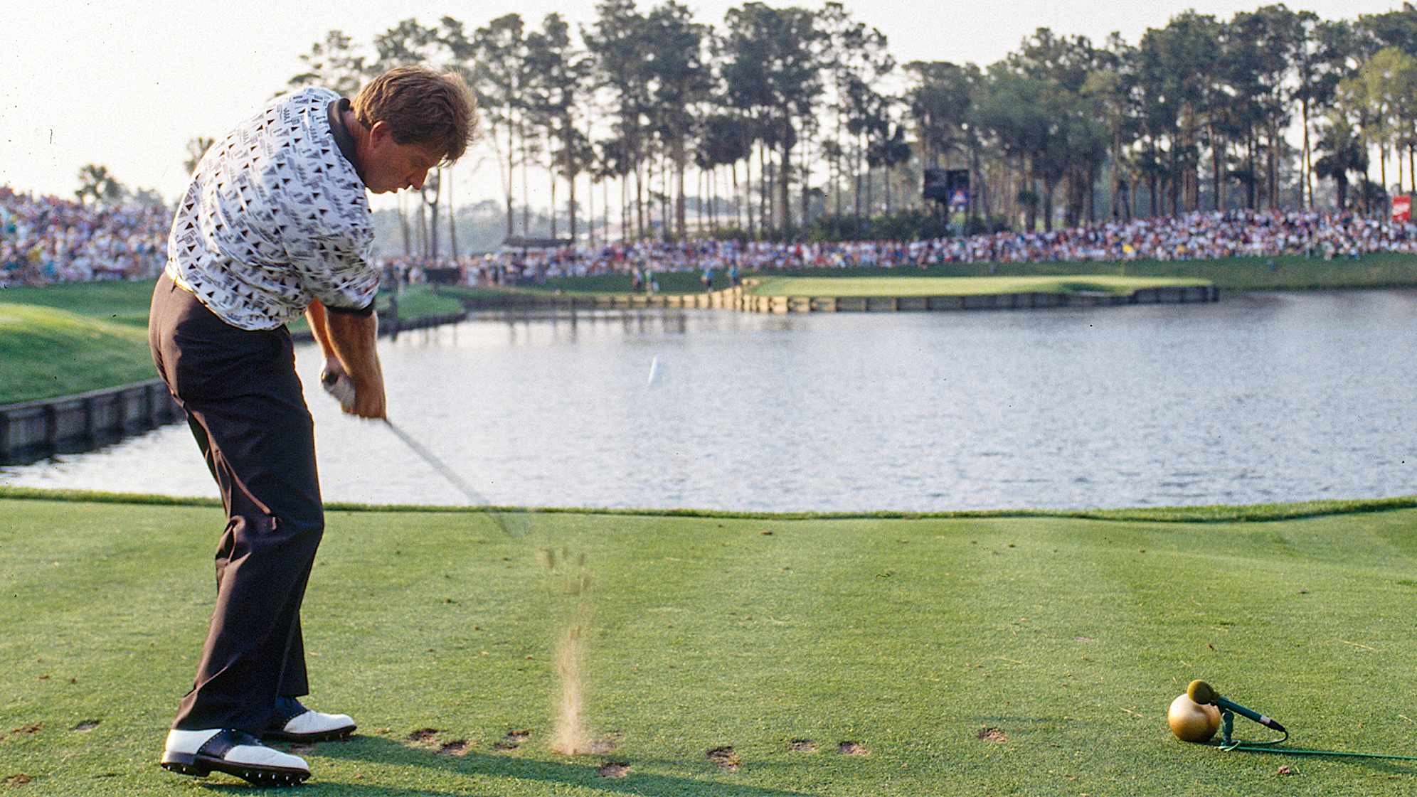 Nick Price playing the island green of TPC Sawgrass at THE PLAYERS Championship. (PGA TOUR Archive)