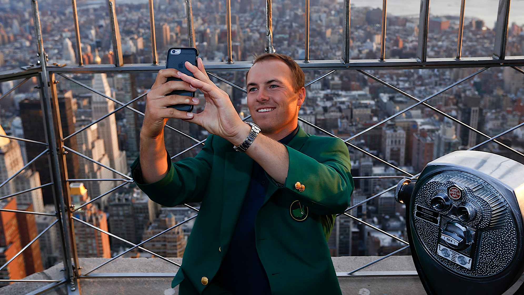 Jordan Spieth taking a selfie with the green jacket on top of the Empire State Building in 2015. (Jeff Zelevansky/Getty Images)