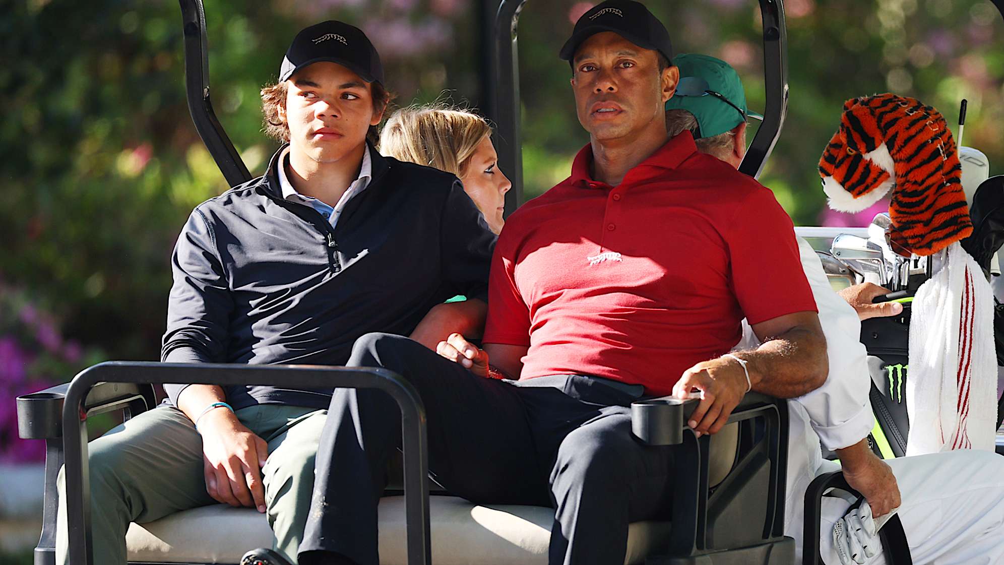 Tiger Woods and his son Charlie Woods depart the practice area in a cart during the final round of the 2024 Masters Tournament. (Andrew Redington/Getty Images)