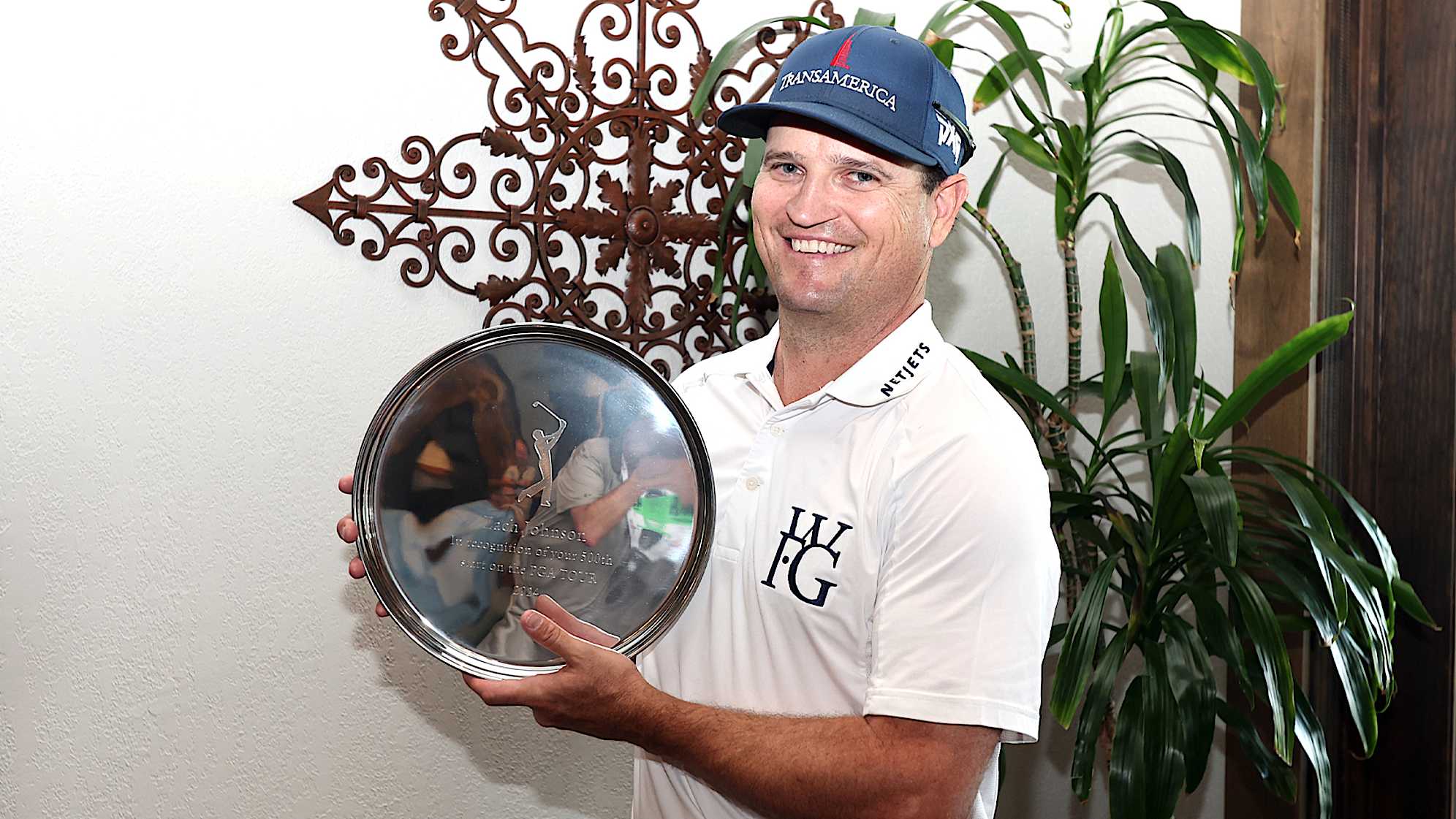 MCKINNEY, TEXAS - MAY 01: Zach Johnson  of the United States holds up a tray commemorating his 500th career start prior to THE CJ CUP Byron Nelson at TPC Craig Ranch on May 01, 2024 in McKinney, Texas. (Photo by Tim Heitman/Getty Images)