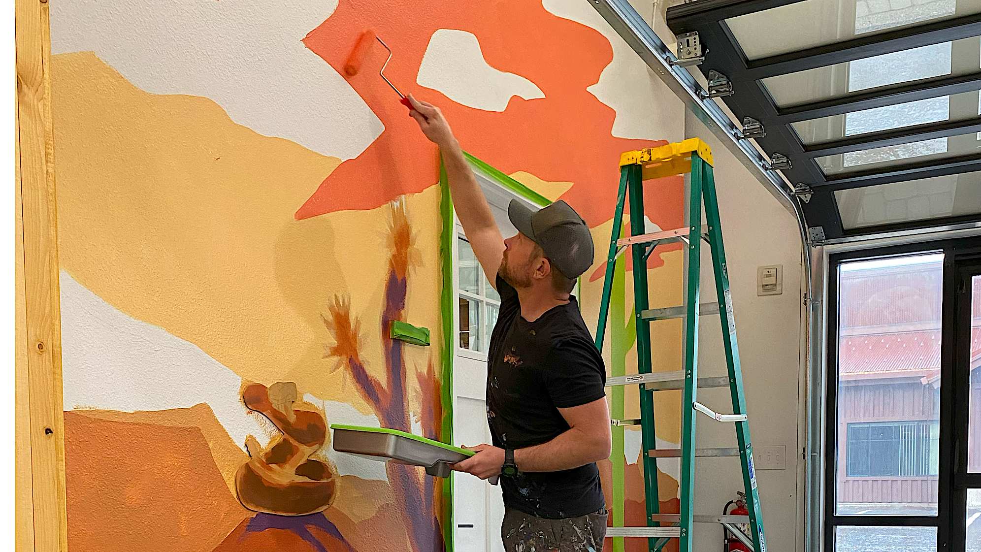 Skye Walker painting mural for Hydrotherapy Room. (Courtesy of Skye Walker)
