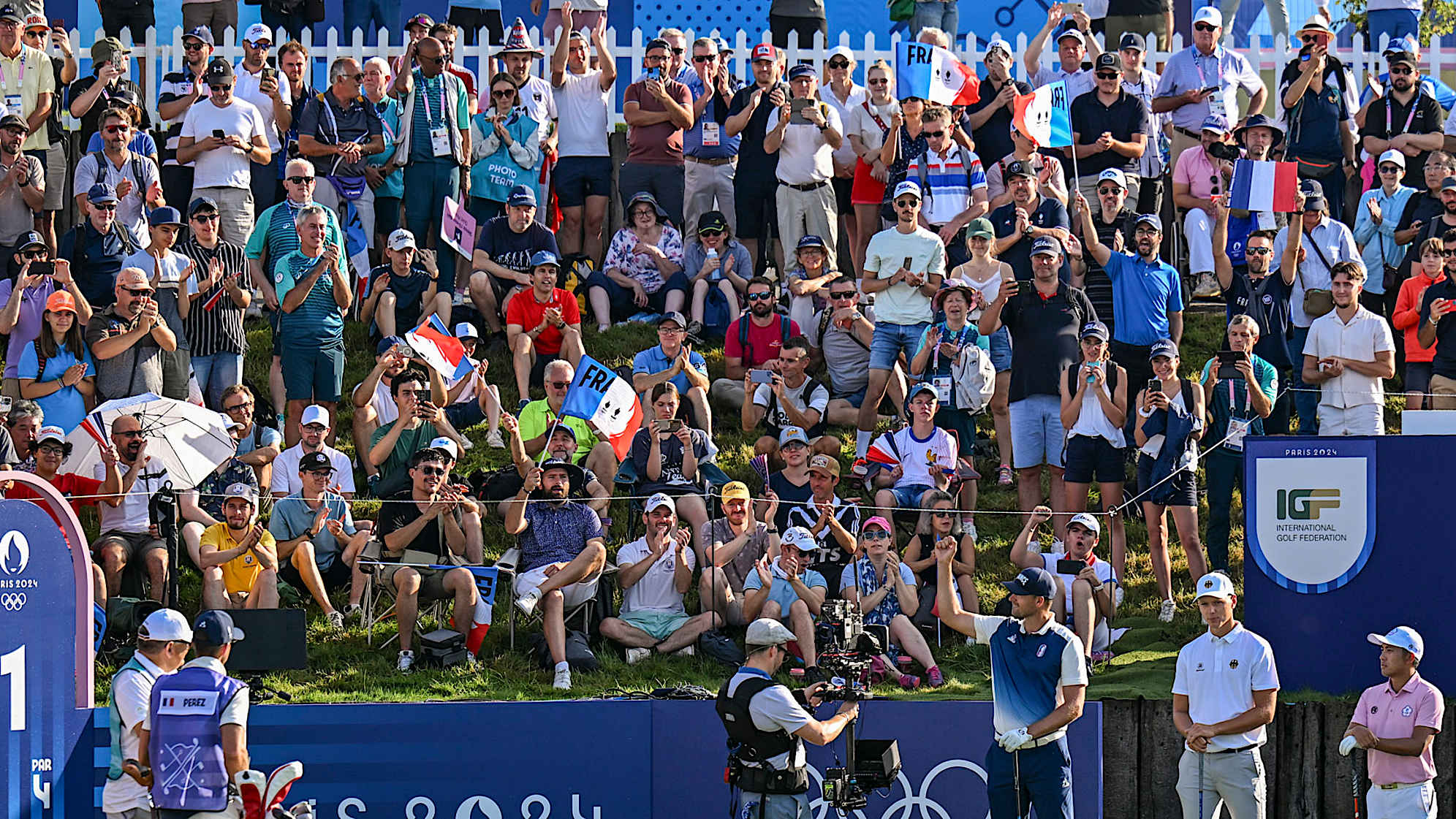 Victor Perez of Team Trance fist bumps to the crowd during the first round of the Olympic men’s golf competition. (Keyur Khamar/PGA TOUR)