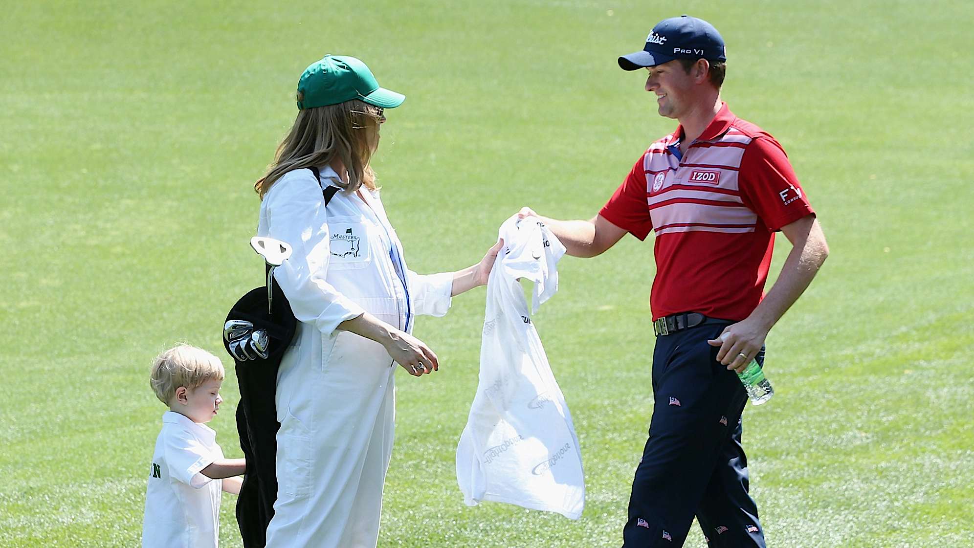 AUGUSTA, GA - APRIL 09:  Webb Simpson of the United States waits with his wife Dowd and their son James during the Par Three Contest prior to the start of the 2014 Masters Tournament at Augusta National Golf Club on April 9, 2014 in Augusta, Georgia.  (Photo by Andrew Redington/Getty Images)