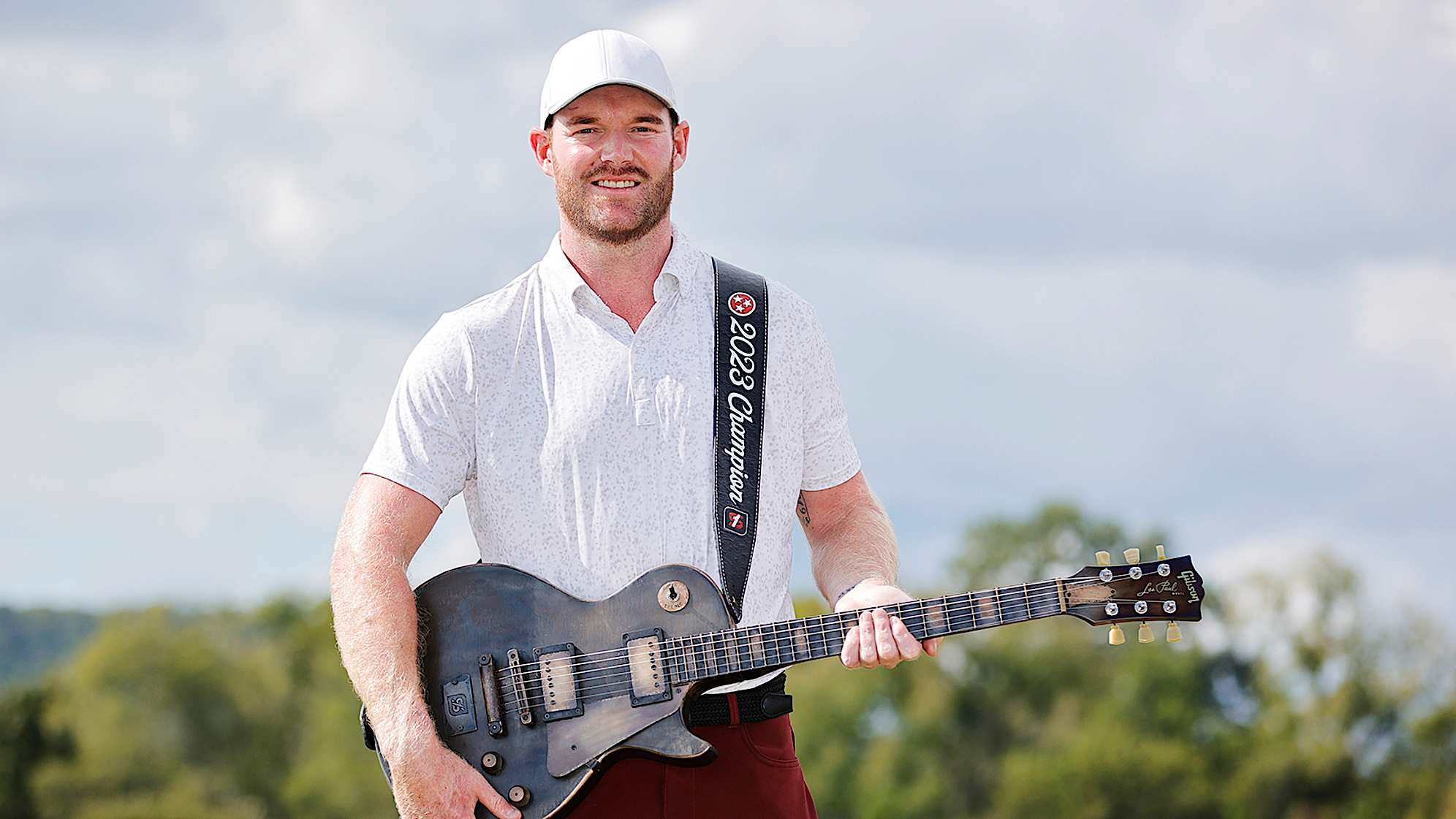Grayson Murray poses with the guitar trophy at the 2023 Simmons Bank Open. (Alex Slitz/Getty Images)