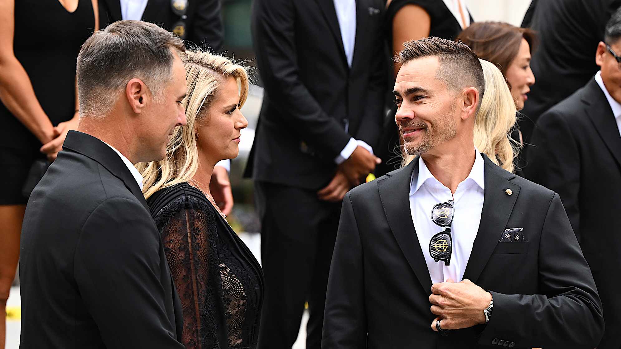Camilo Villegas (R) talks with Trevor and Carminita Immelman (L) at The Ring in Montreal, Quebec. (Tracy Wilcox/PGA TOUR)