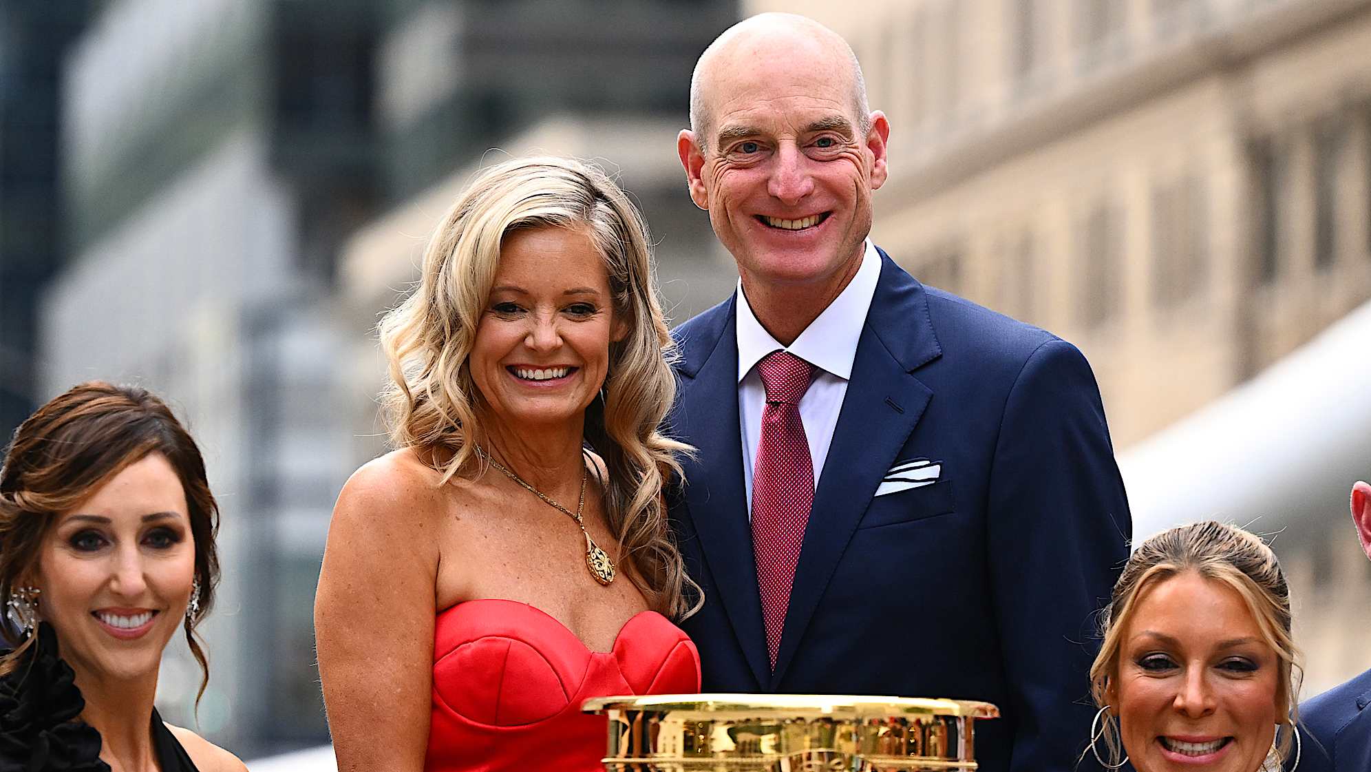 MONTREAL, QUEBEC - SEPTEMBER 24: Jim Furyk U.S. Team Captain and his wife Tabitha pose for a photo near the trophy at The Ring before attending the Presidents Cup Celebration prior to the 2024 Presidents Cup at The Royal Montreal Golf Club on September 24, 2024 in Montreal, Quebec. (Photo by Tracy Wilcox/PGA TOUR via Getty Images)
