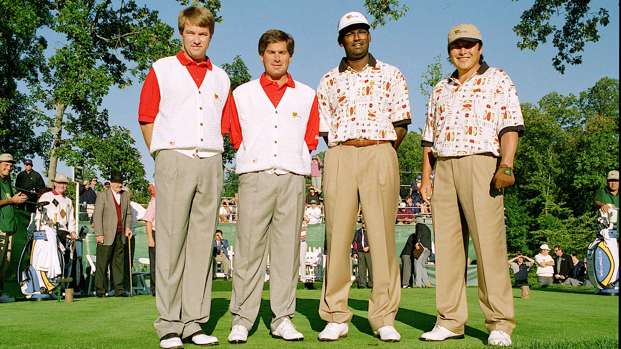 From left to right, Davis Love III, Fred Couples, Vijay Singh, and Jumbo Ozaki pose during the 1996 Presidents Cup. (Stan Badz/PGA TOUR)