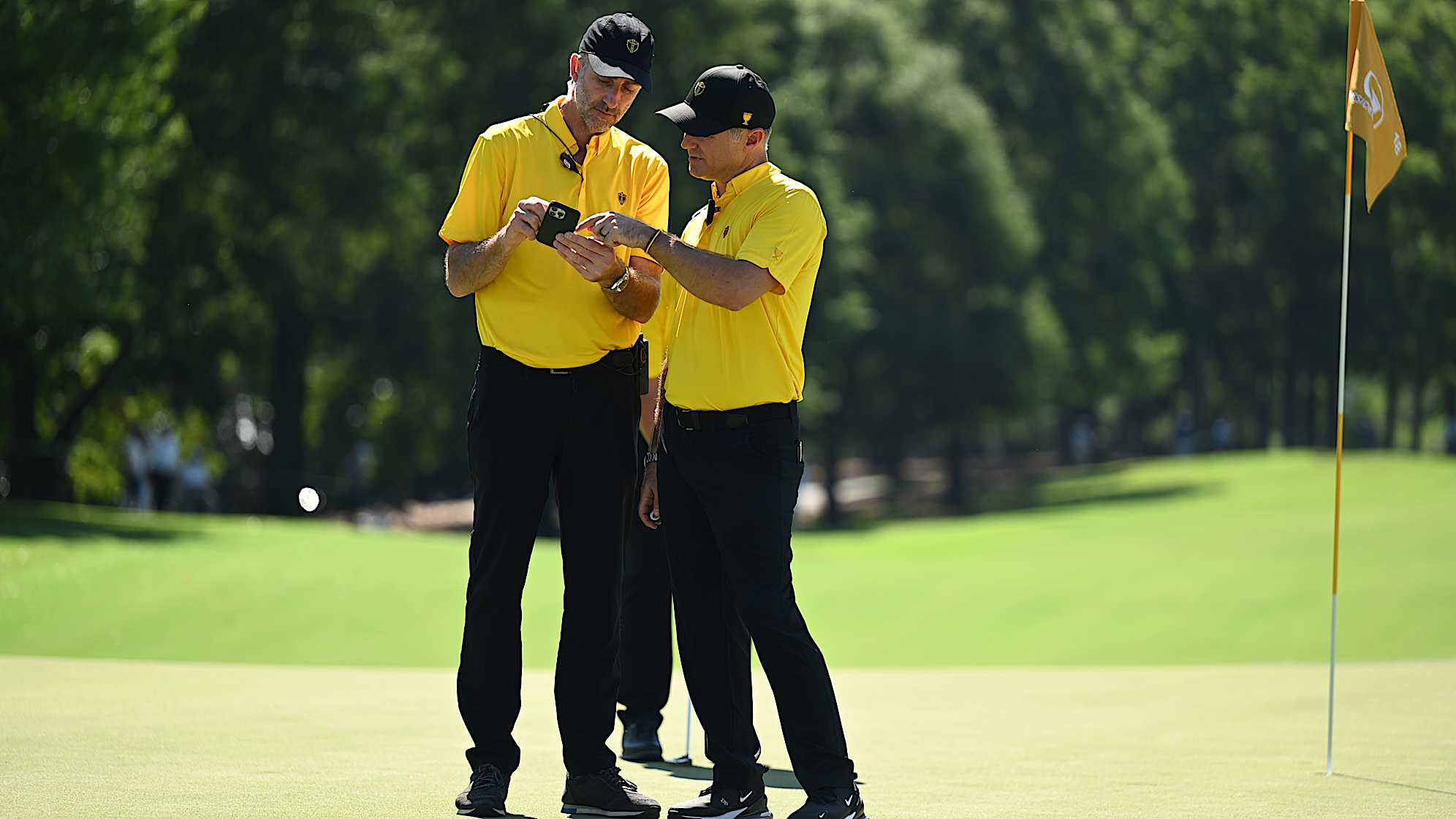 International Team Captain Trevor Immelman and Captain's Assistant Geoff Ogilvy at the 2022 Presidents Cup at Quail Hollow. (Keyur Khamar/PGA TOUR)
