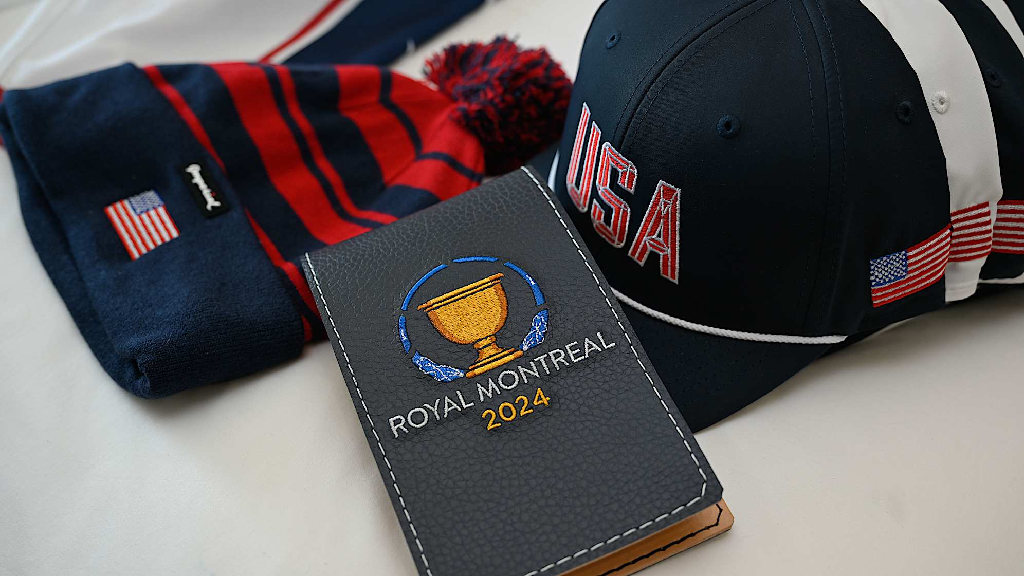U.S. Team hats and yardage book cover are laid out prior to Presidents Cup at The Royal Montreal Golf Club on September 20, 2024 in Montreal, Quebec, Canada. (Ben Jared/PGA TOUR)