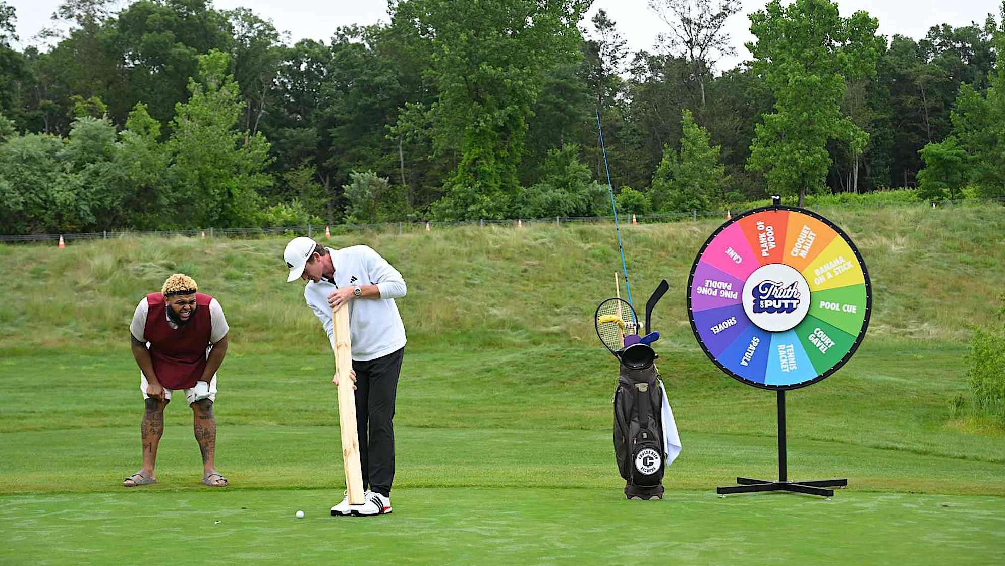 Druski (left) and Nick Dunlap are seen participating in "Truth or Putt." (Credit PGA TOUR) 