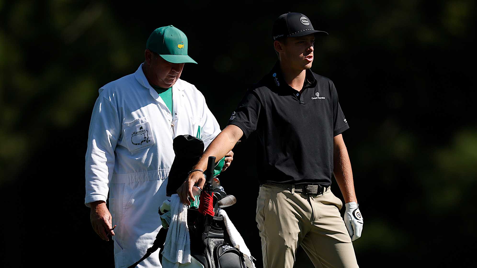 AUGUSTA, GEORGIA - APRIL 11: Amateur Justin Hastings of Cayman Islands looks on with caddie Derrick Redd from the fifth fairway during the second round of the 2025 Masters Tournament at Augusta National Golf Club on April 11, 2025 in Augusta, Georgia. (Photo by Harry How/Getty Images)