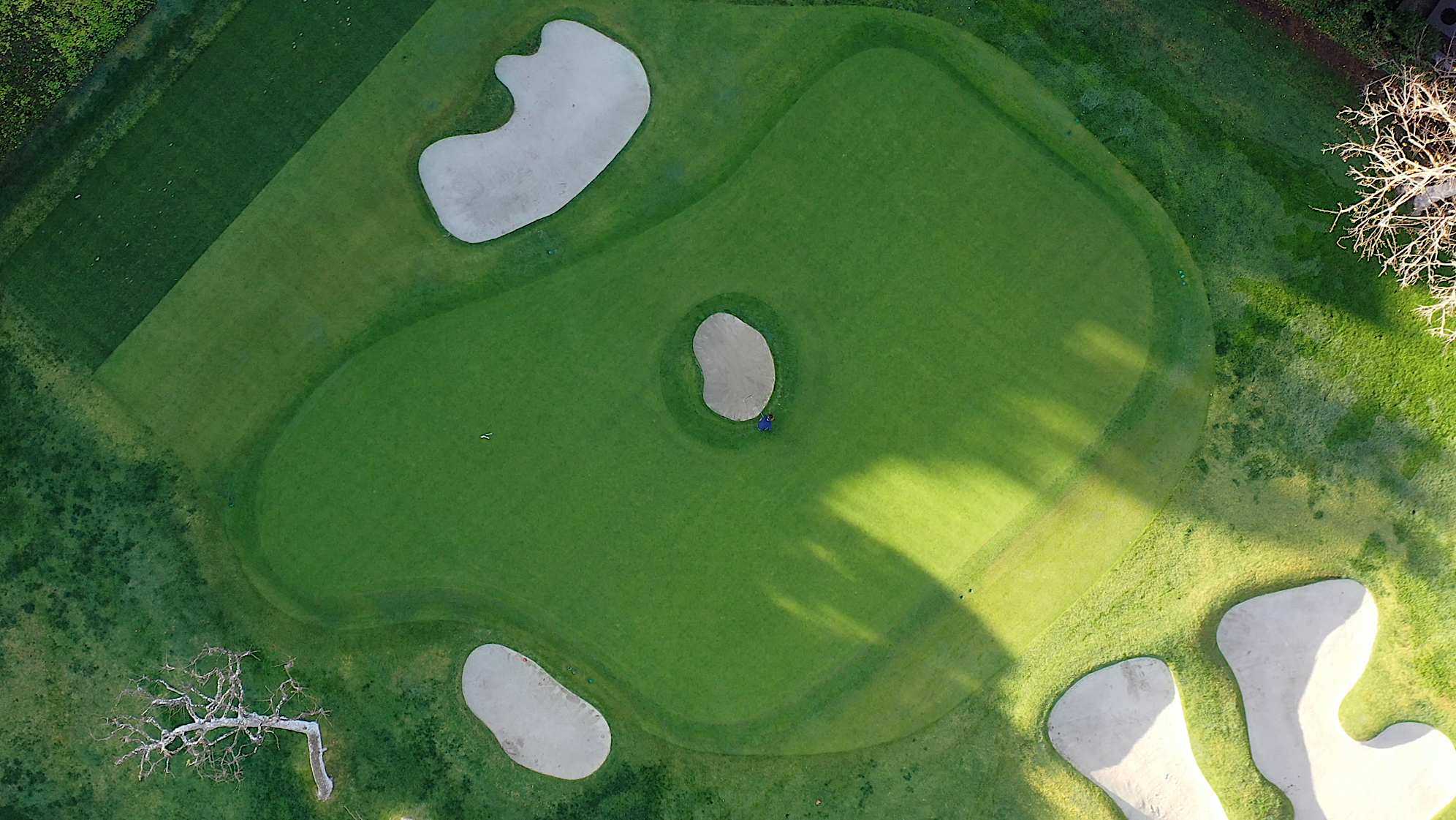 An aerial view of the par-3 sixth hole at The Riviera Country Club, featuring the unique bunker in the center of the green. (PGA TOUR)