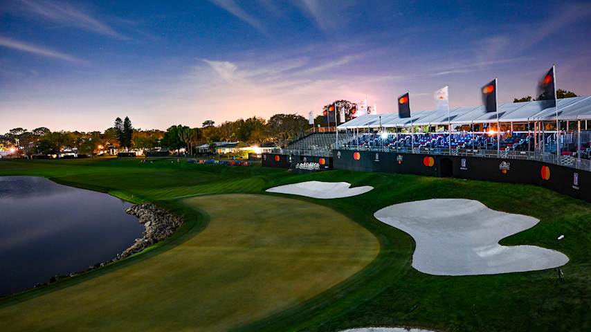 Bay Hill eighteenth green and championship grandstands at dusk
