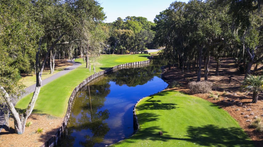 This is a beautiful aquatic layout with water from tee to green on the right. Thanks to overhanging trees, the green is a small, isolated target with an adjacent, small pot bunker bound to act as a magnet for the unsuspecting.